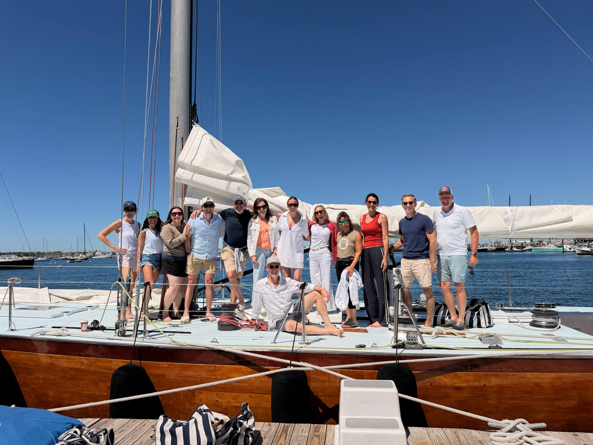 The group aboard a classic sailing yacht