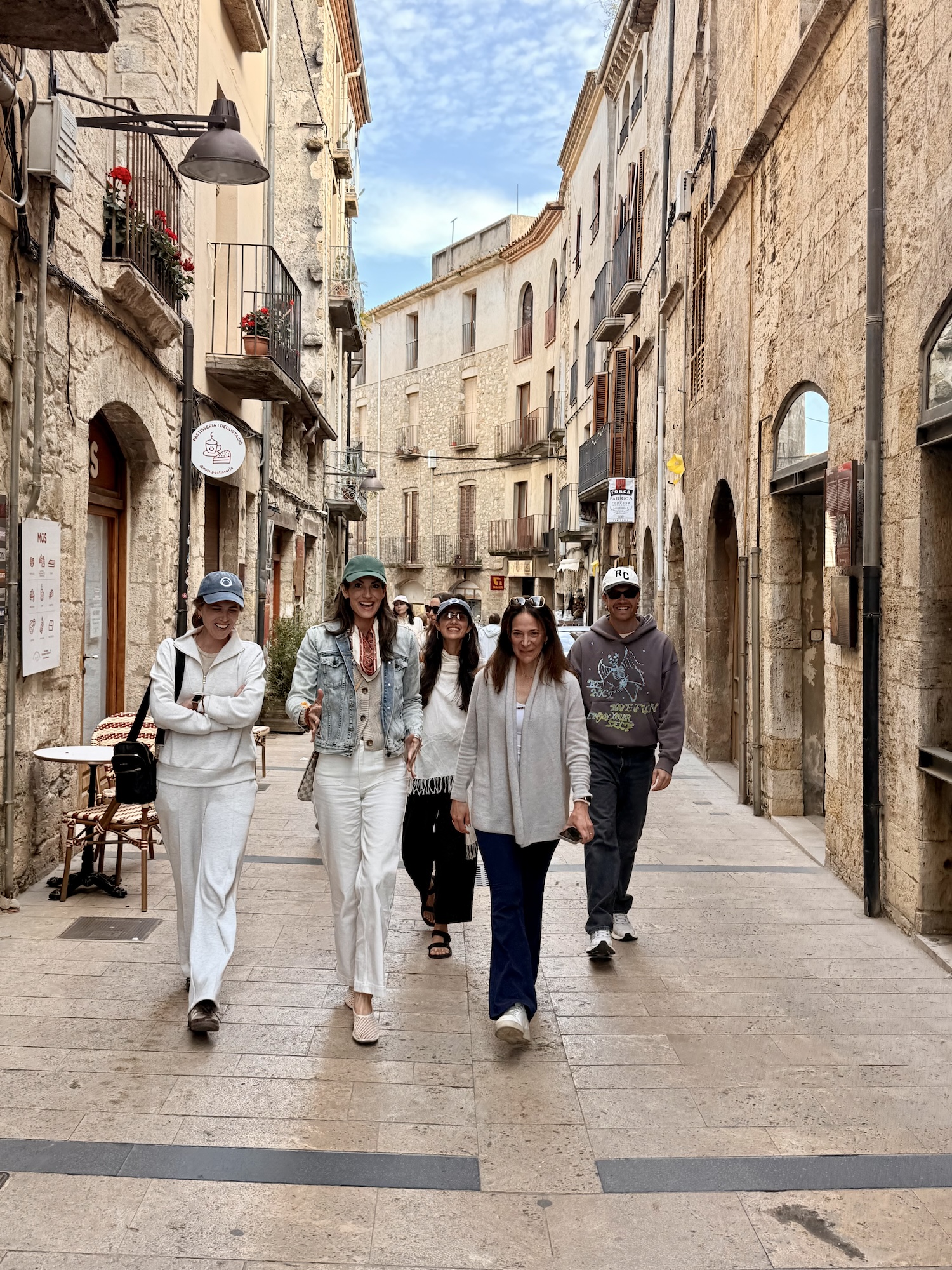 Walking together through the narrow medieval streets of Girona