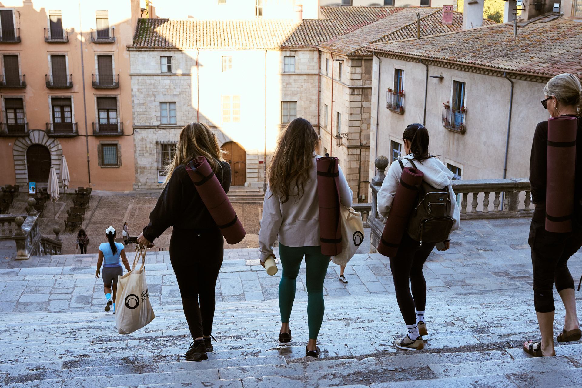 Participants climbing the cathedral steps into the old town