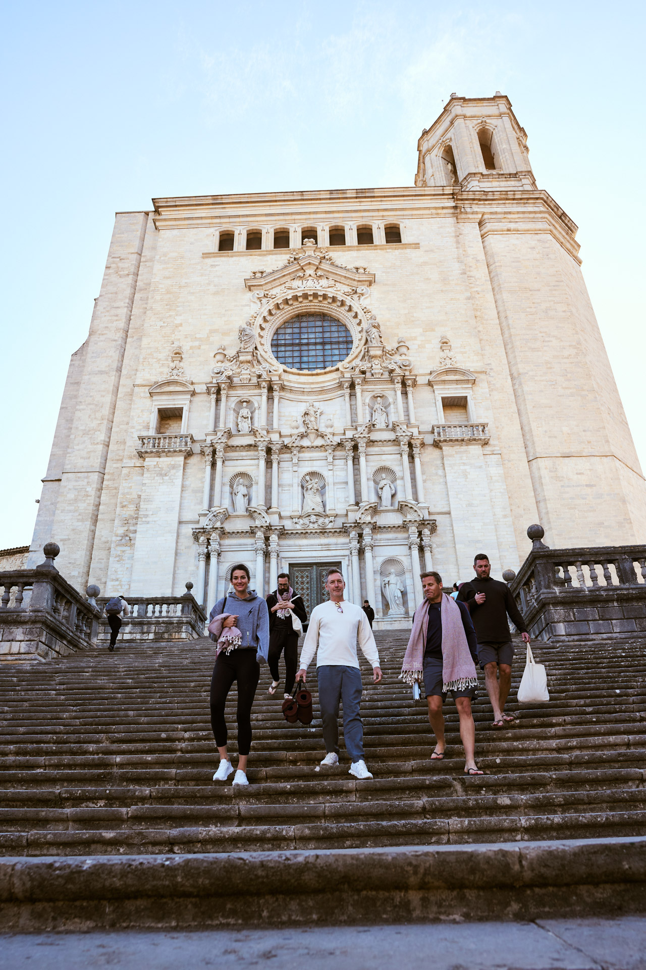 The cathedral's grand stone staircase with people on the steps