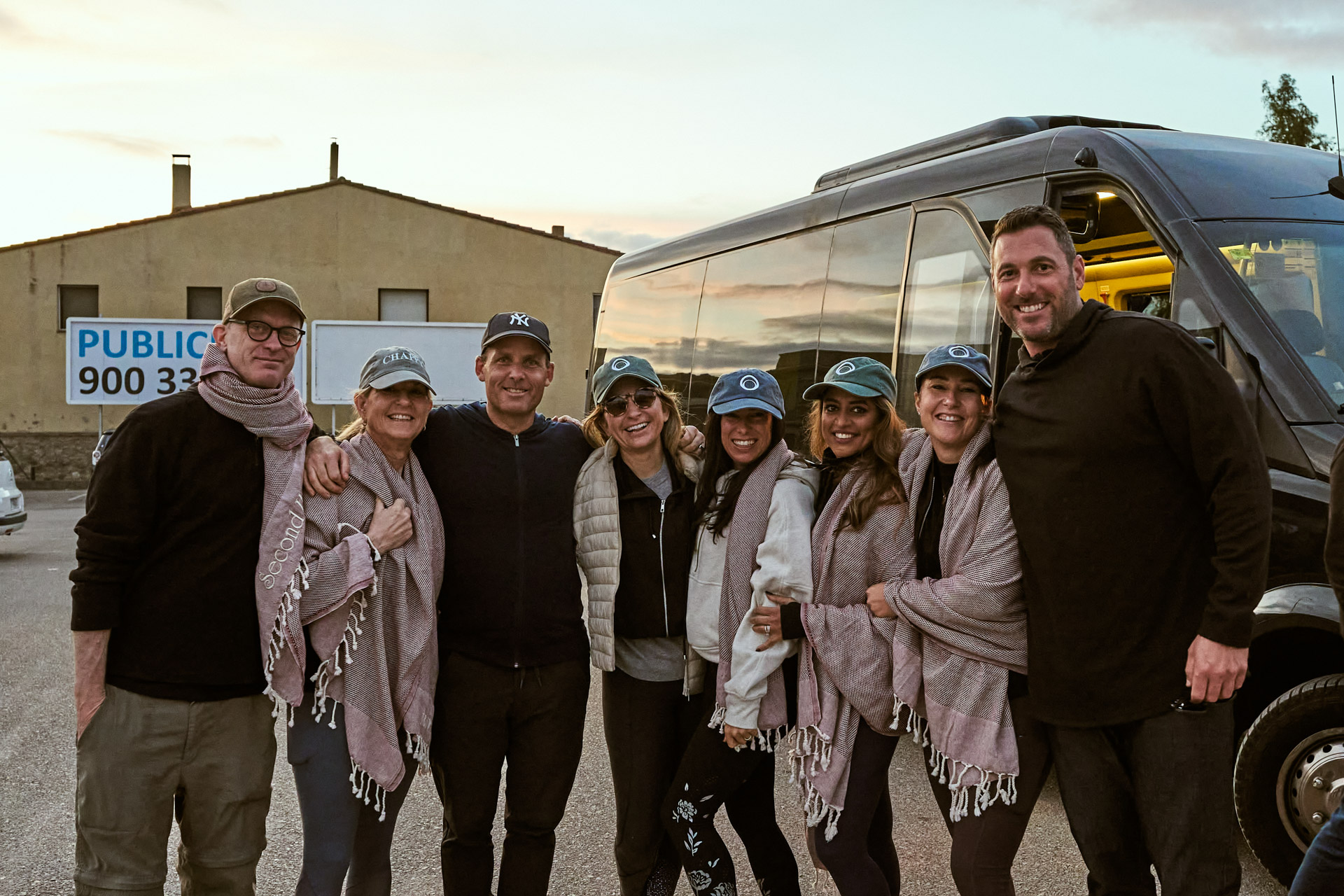The group gathered beside the minibus before a day trip