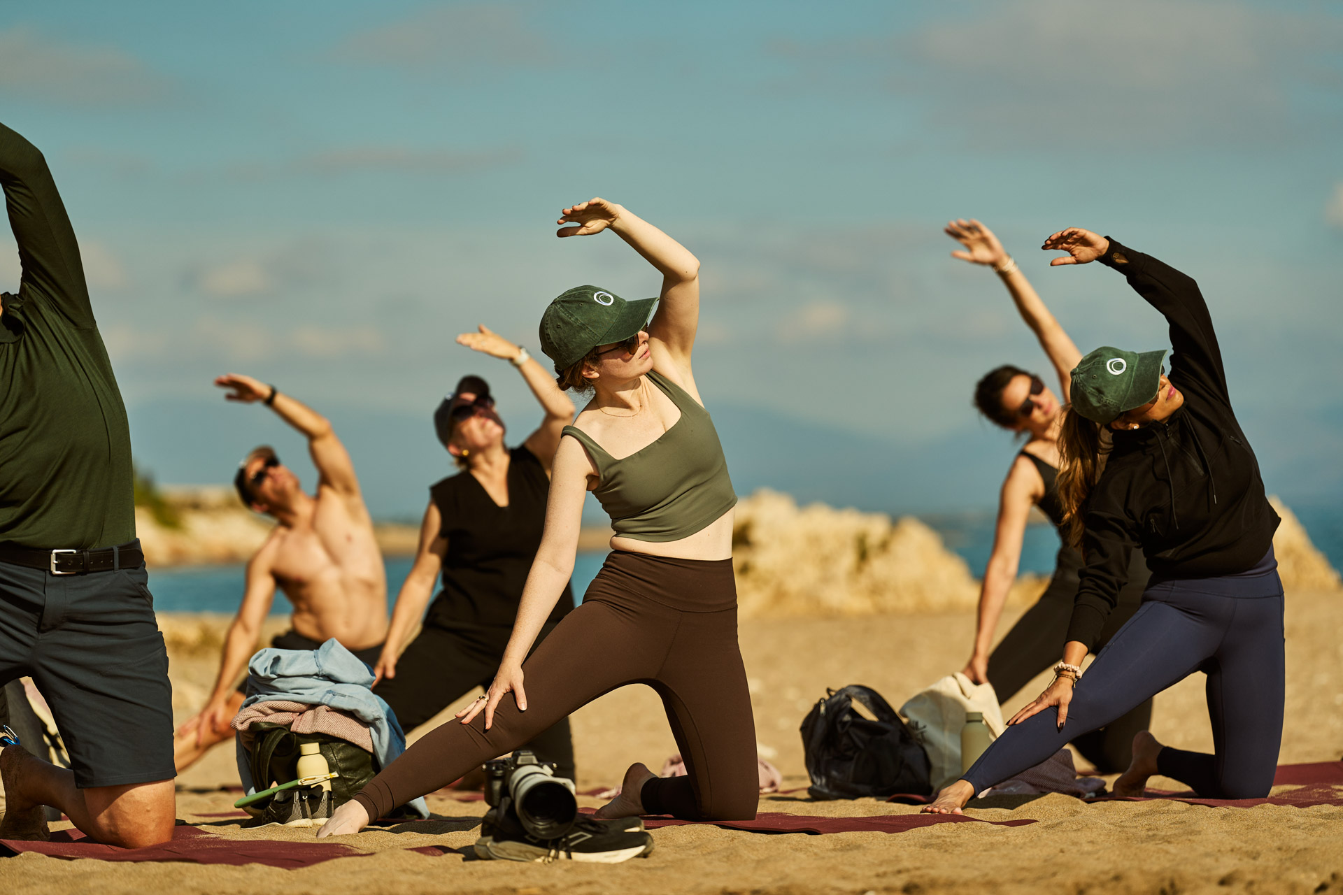 Beach stretching session with arms overhead