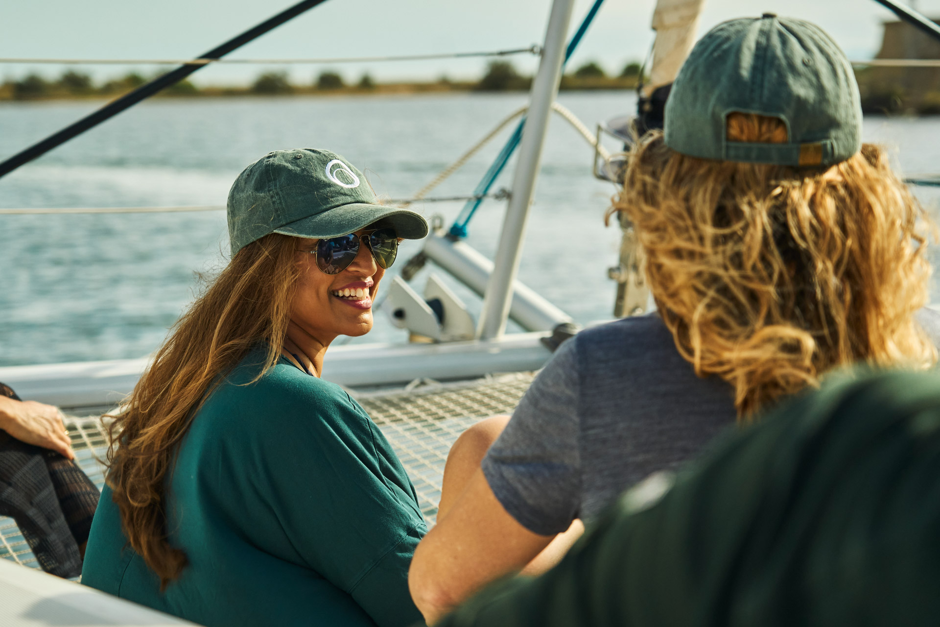 Sailing along the coast, conversation on deck