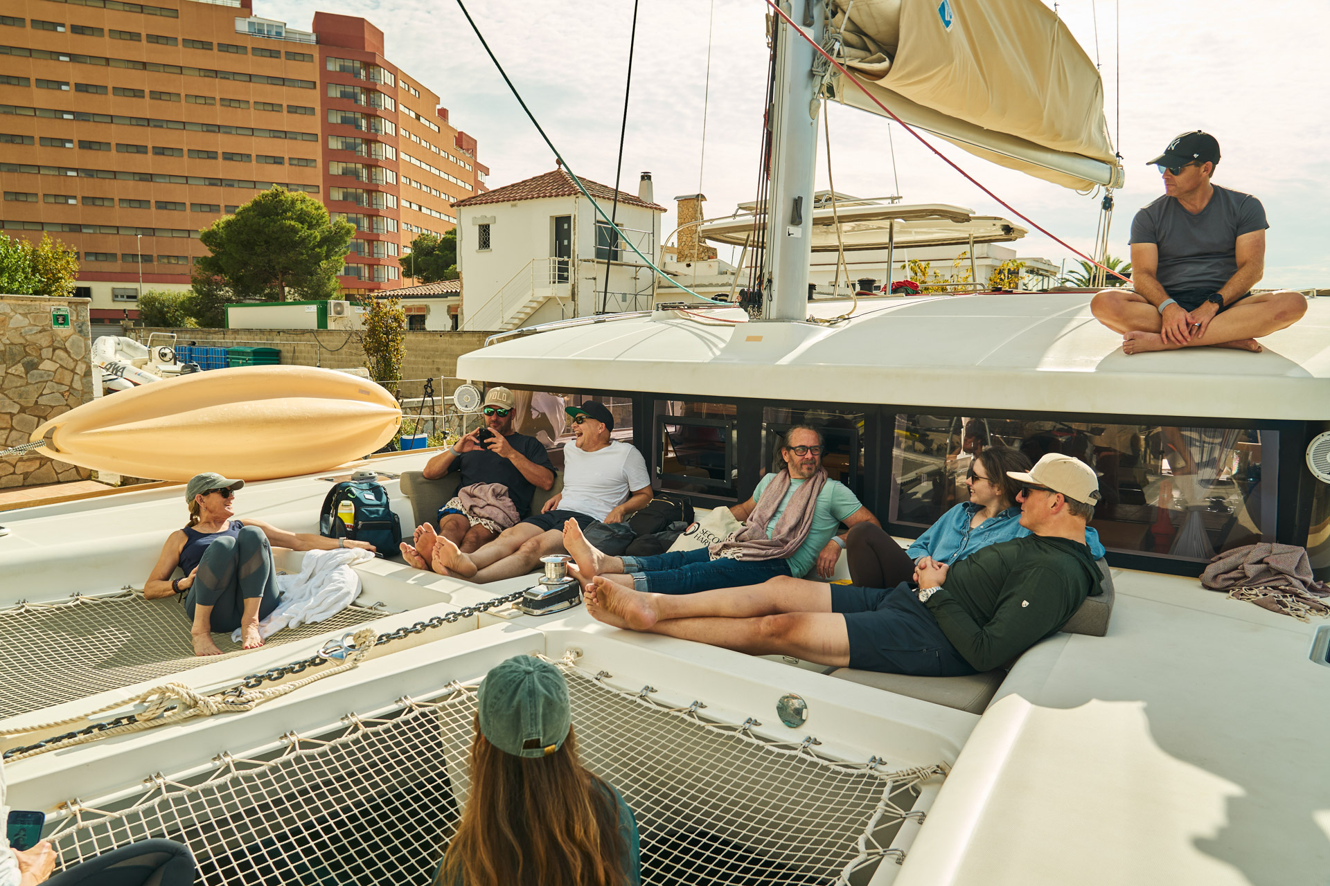 The group aboard a catamaran under sail