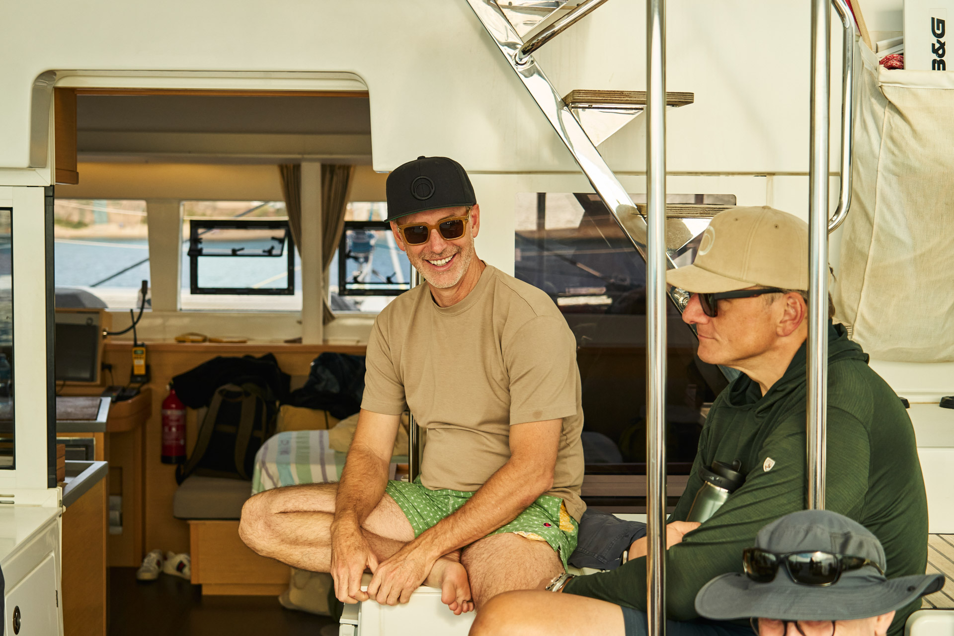 Two participants talking below deck