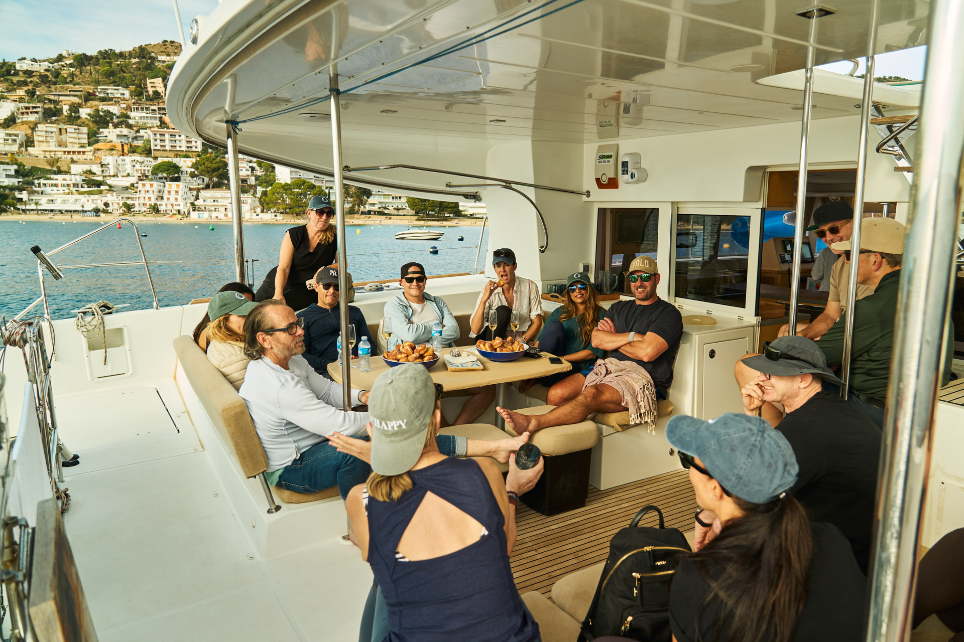 The group gathered around the table on the catamaran