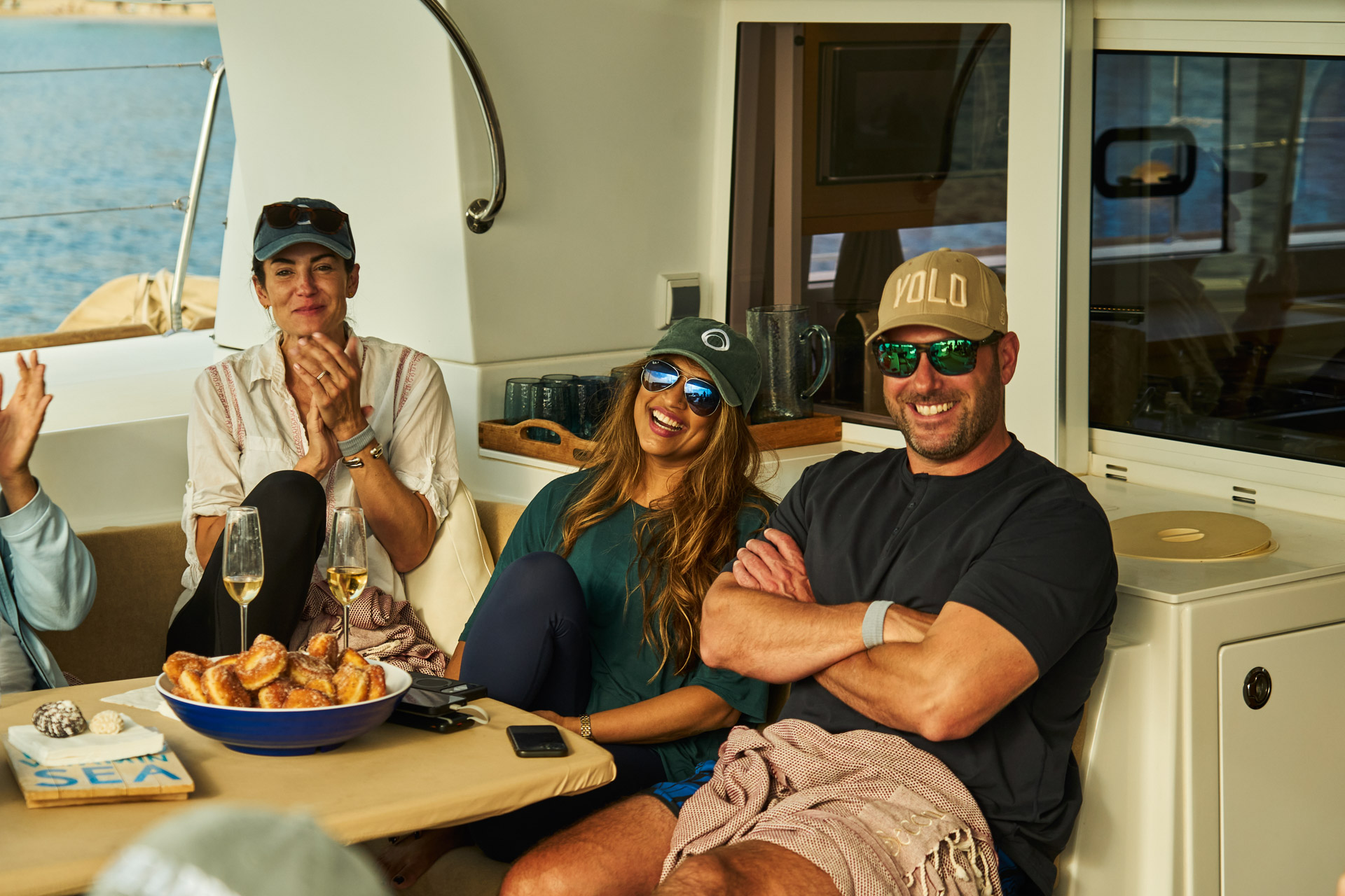 Participants gathered around the table in the boat's galley