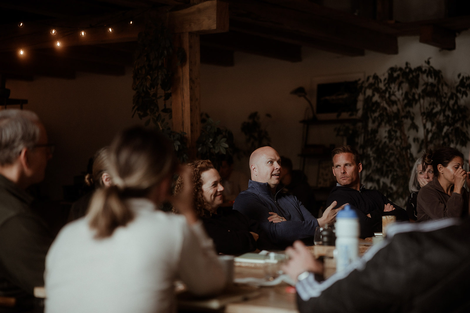 Group seated around a long table for a working session