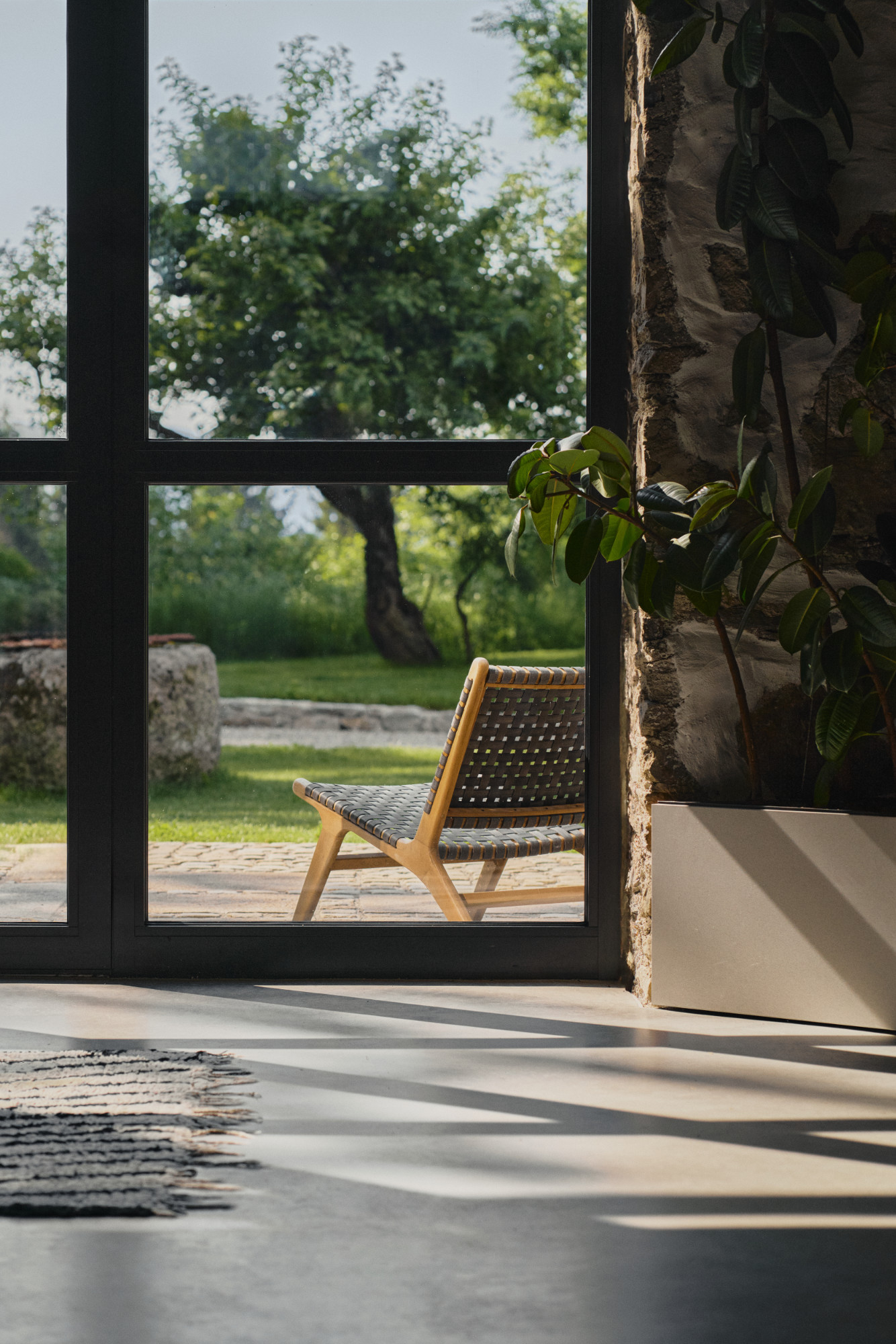 Looking out from inside to a chair on the terrace