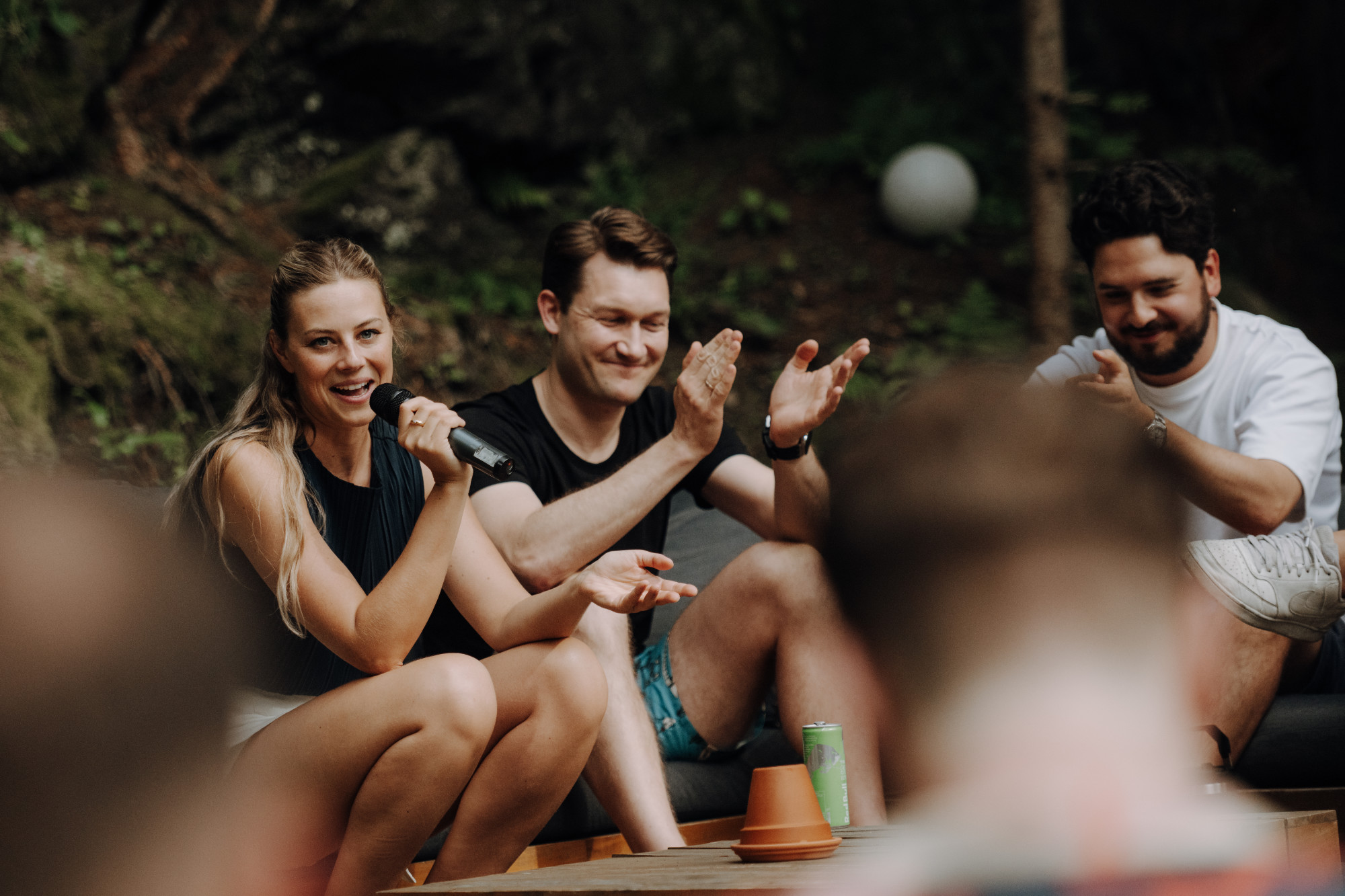 Guests laughing together during a group session outdoors