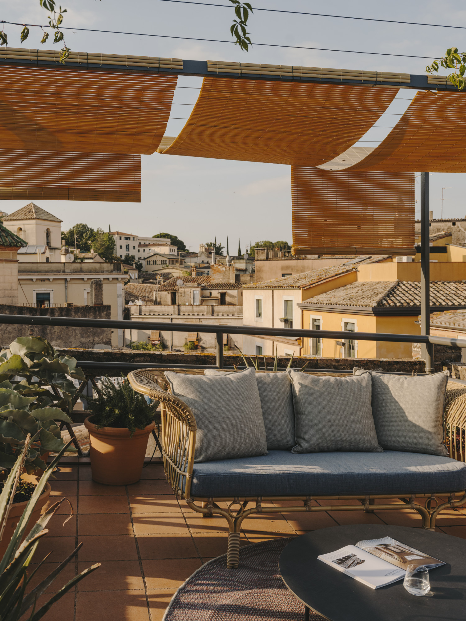 Rooftop terrace with a sofa overlooking the old town