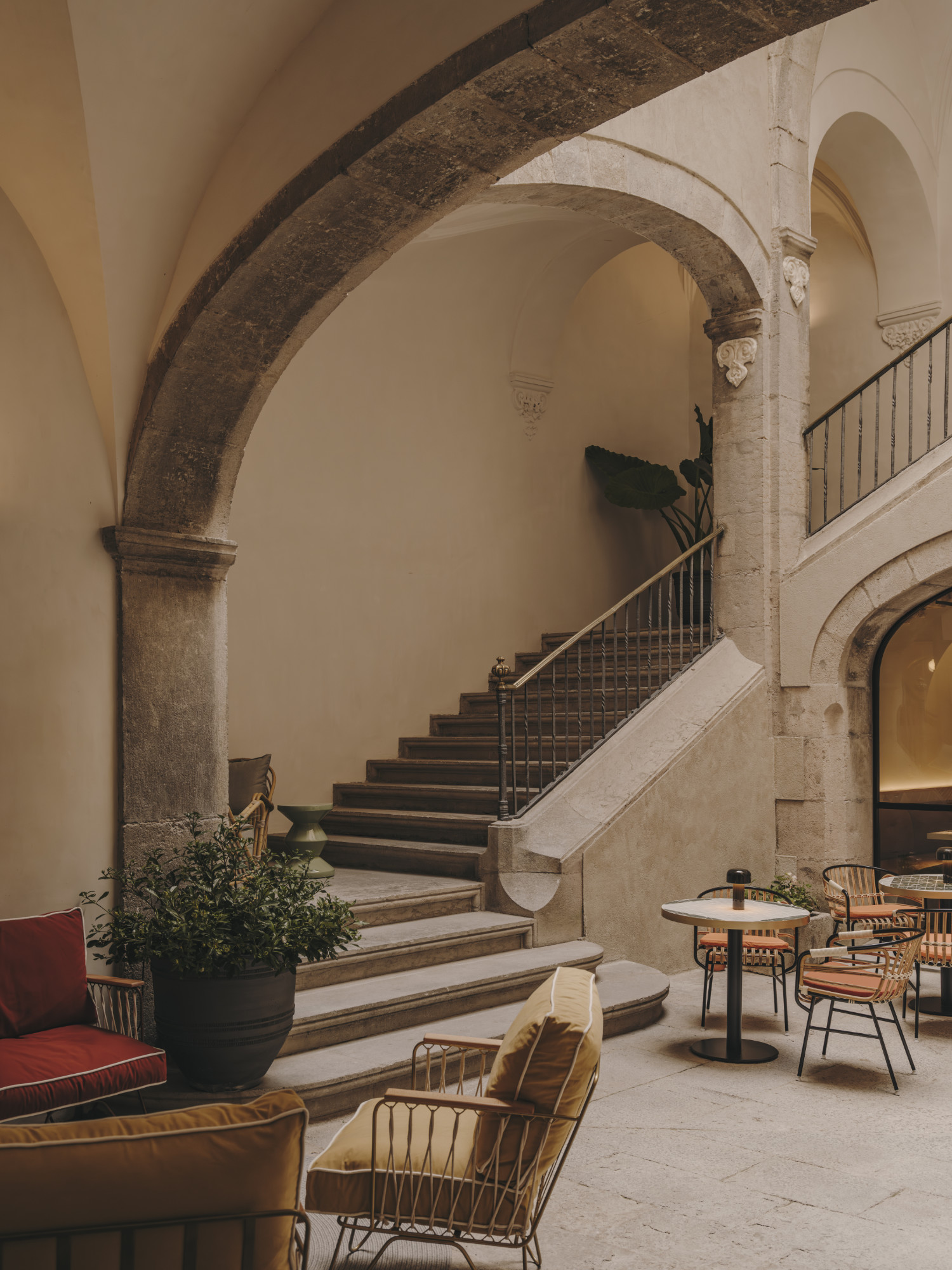 Stone staircase and arched courtyard of the retreat house