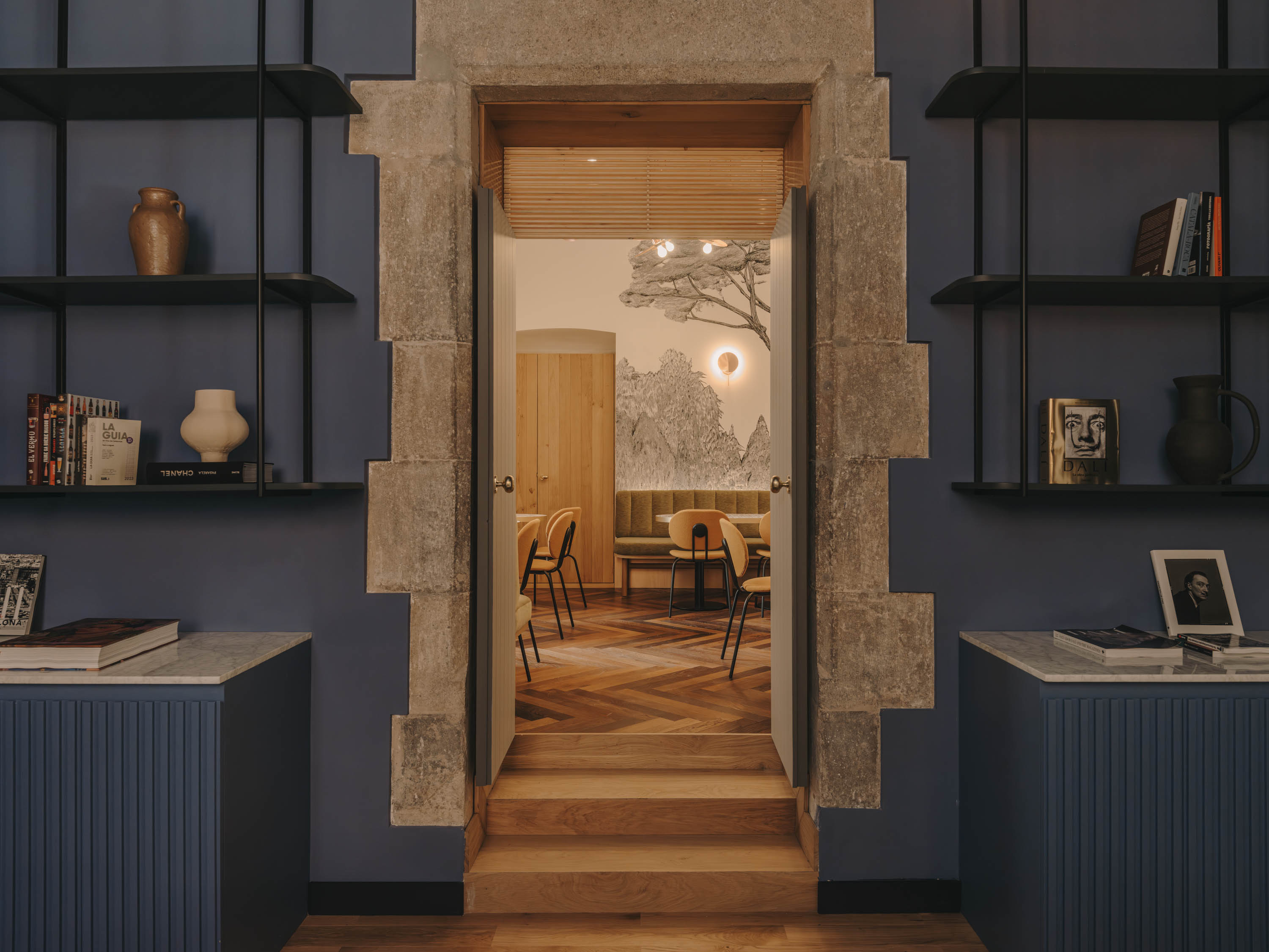 Doorway between a study and a dining room in the retreat house