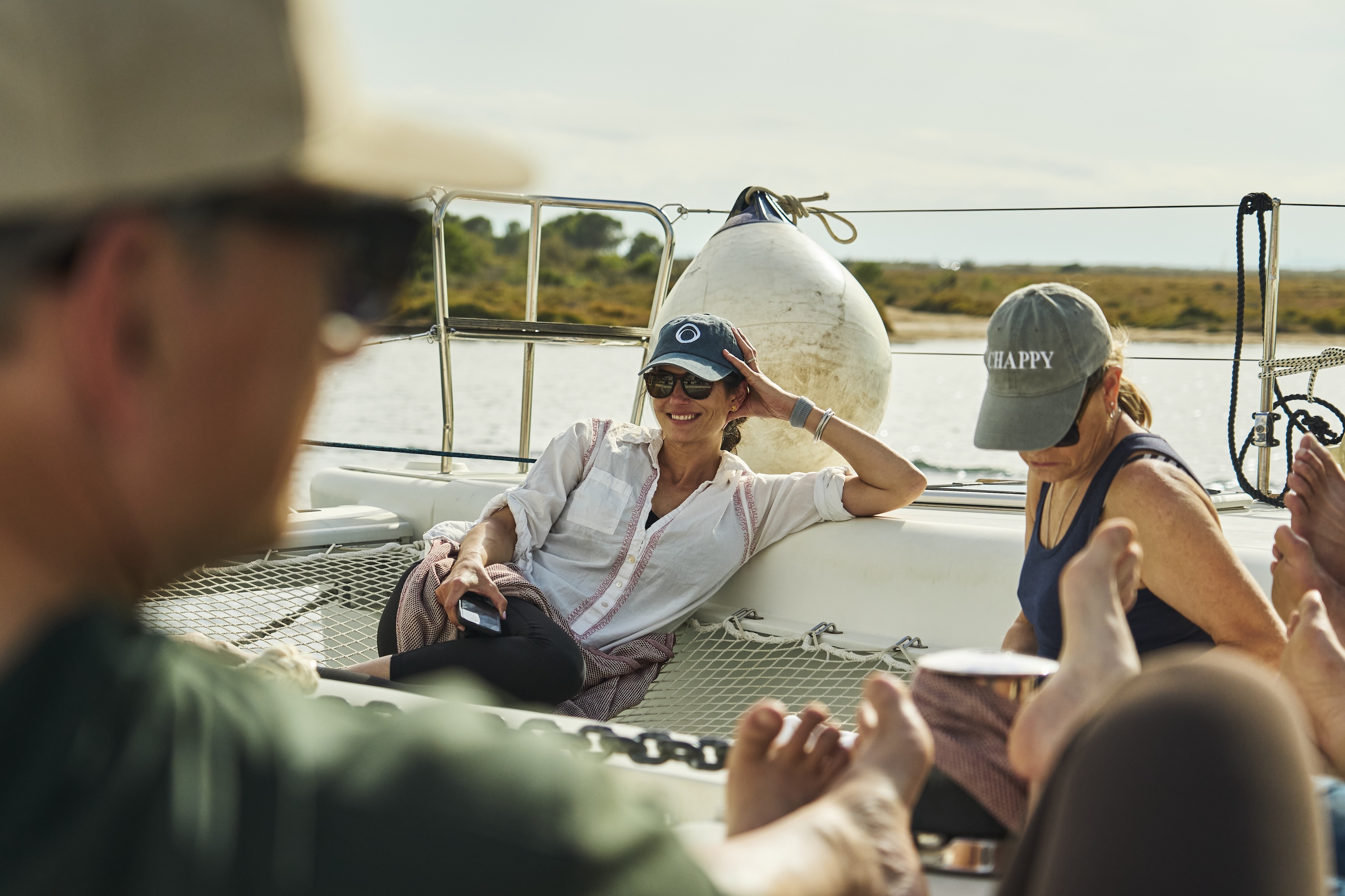 Participants relaxing on the deck of a boat