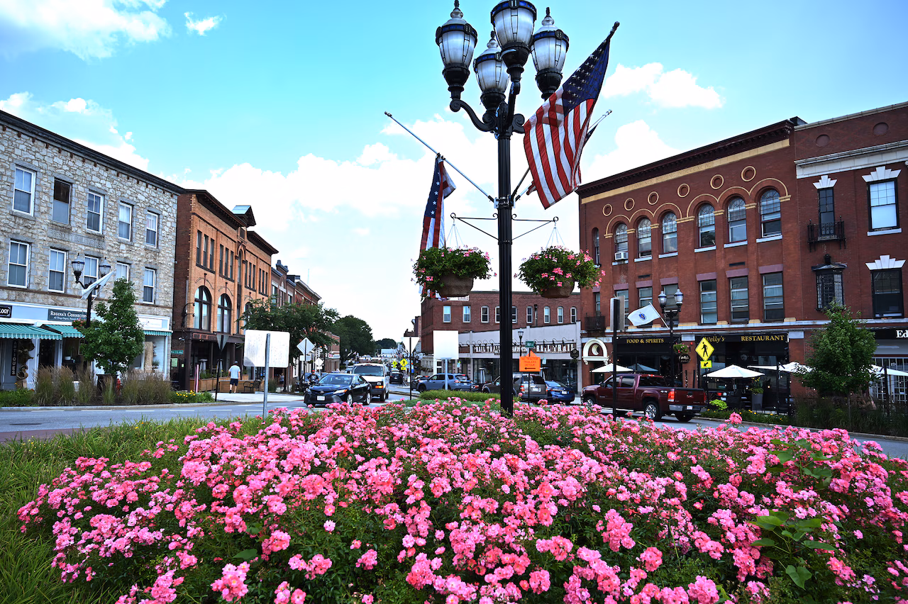 A New England main street with flower beds in bloom