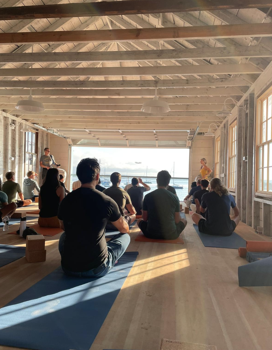 Meditation session on mats in the boathouse