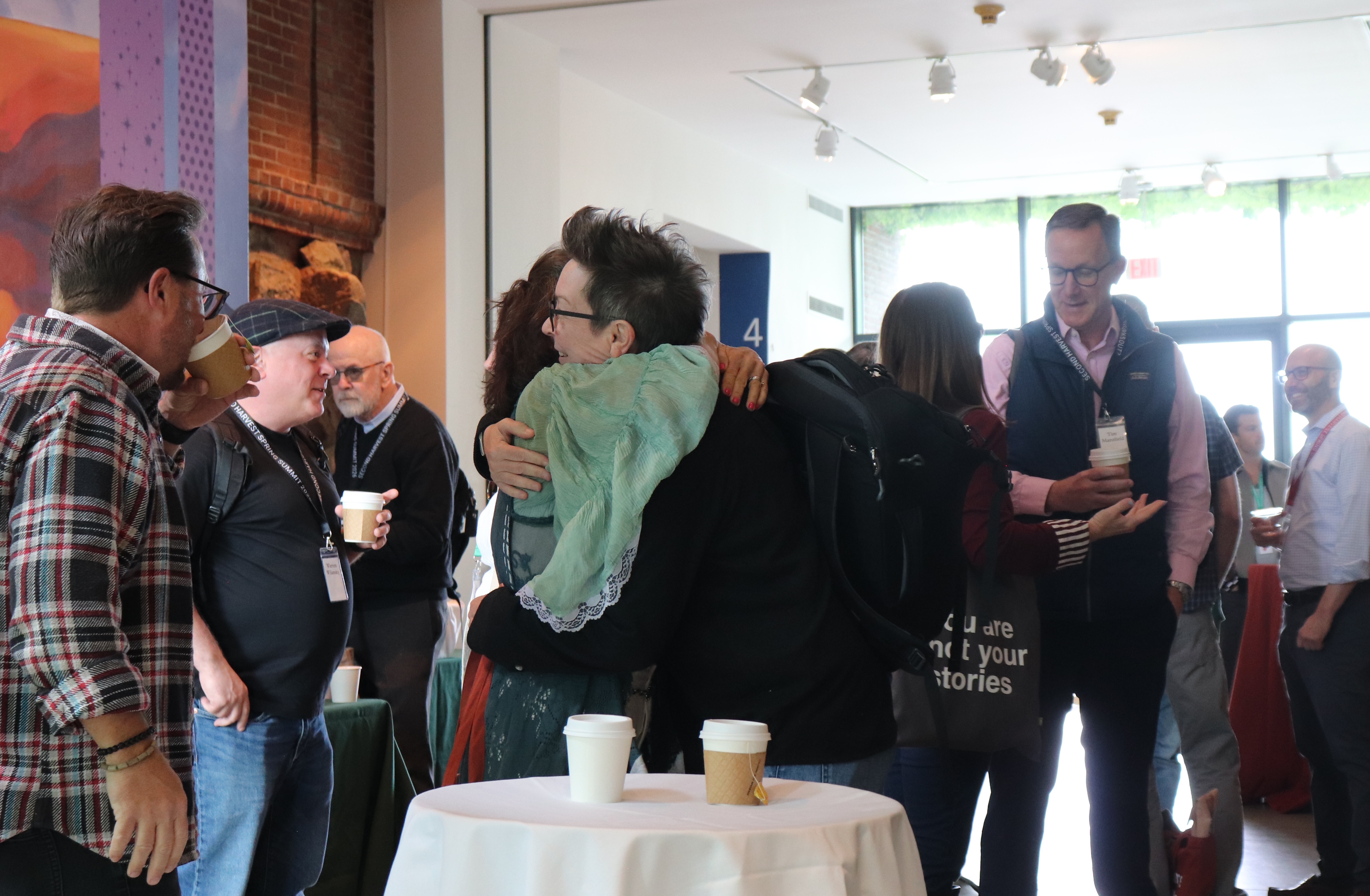 People greeting and embracing at a gathering