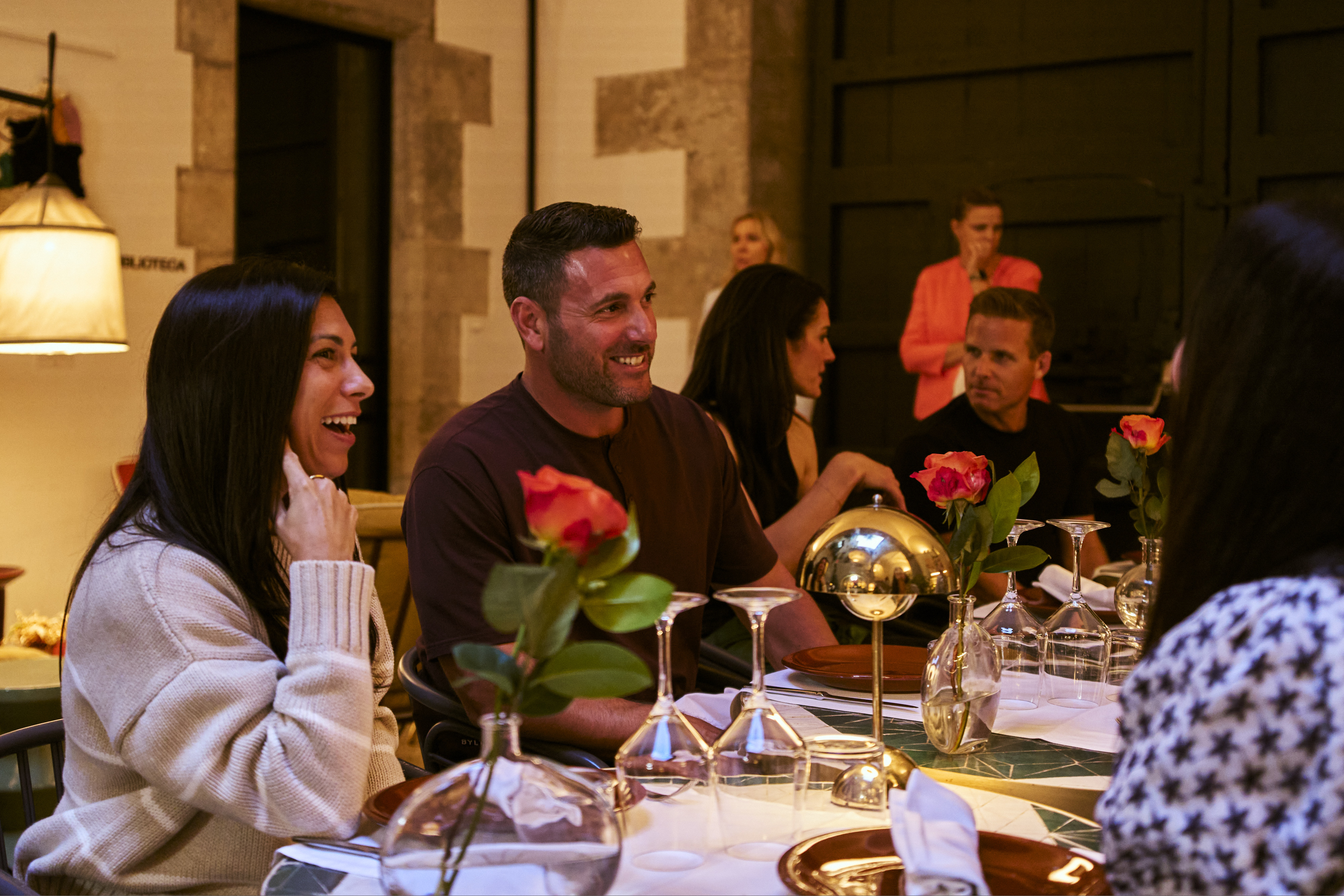 Laughter and conversation around a festive dinner table