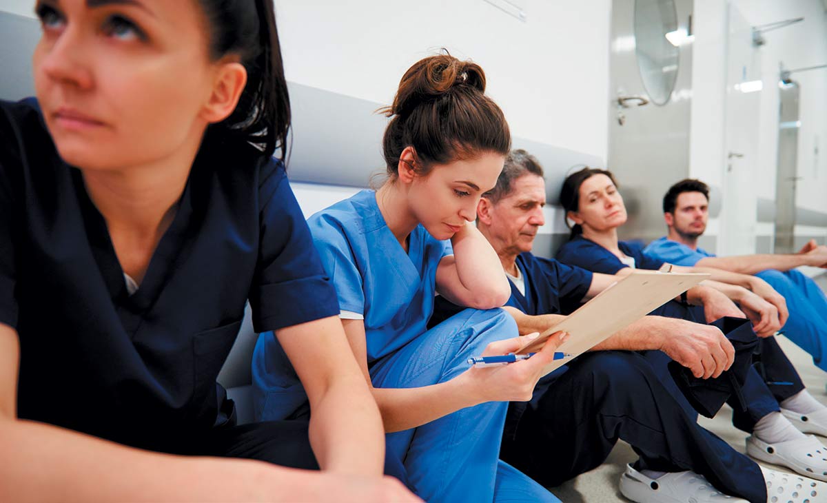 clinicians sitting in a hallway