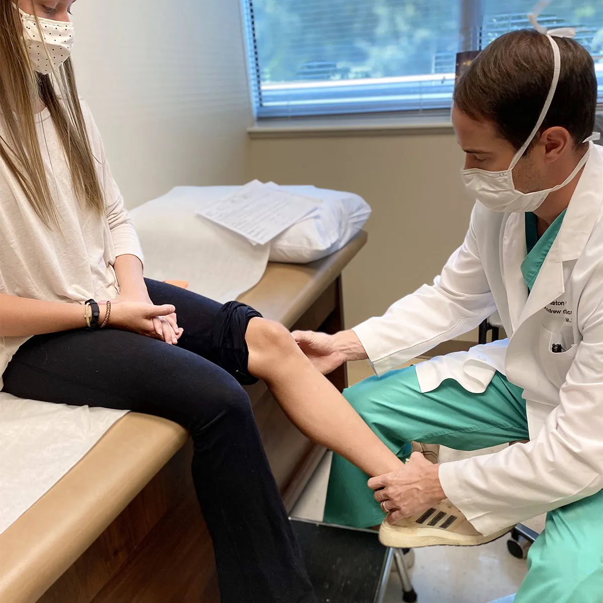 Dr. Morris with a patient.
