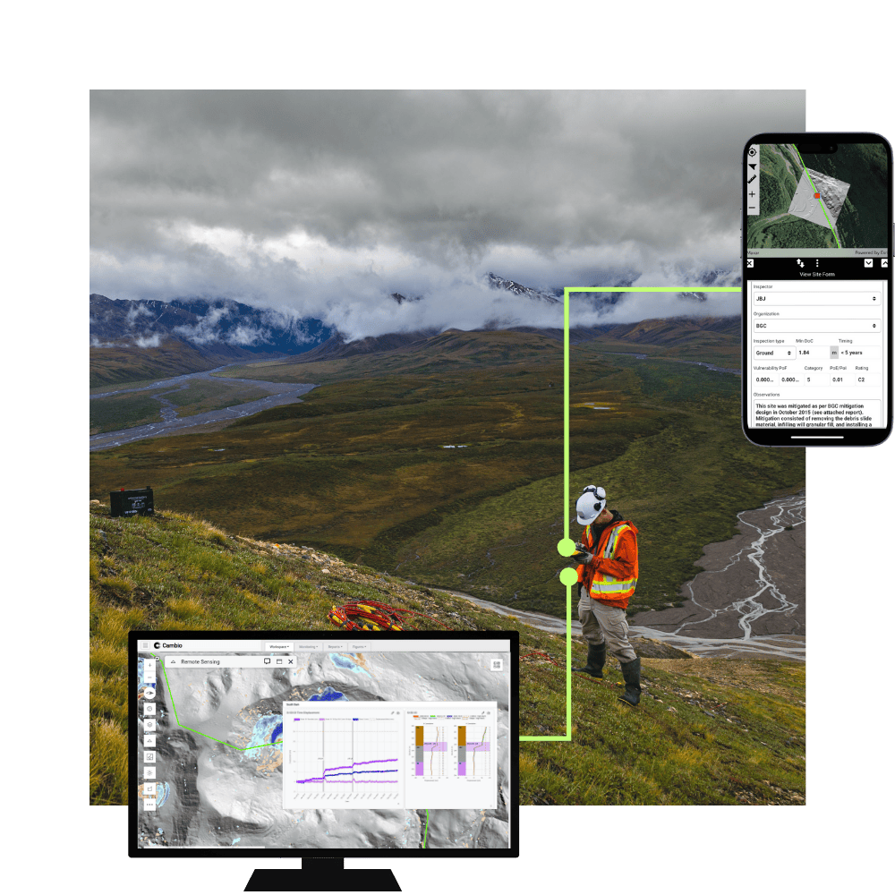 Person in safety gear on grassy hillside using a device, with remote sensing data displayed on a computer monitor and a site inspection form on a smartphone screen.