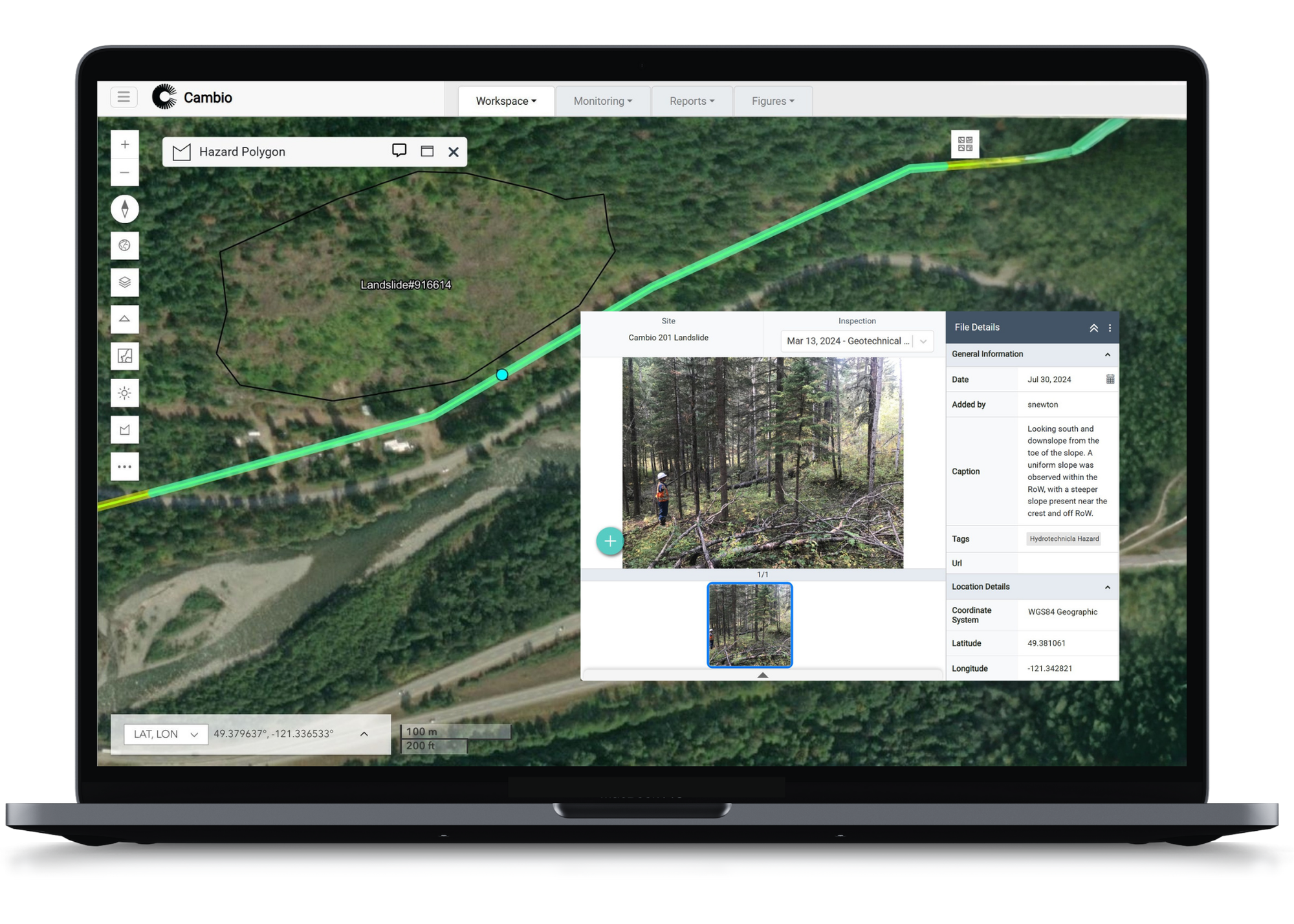 Laptop screen showing a geographic information system with a highlighted landslide polygon, a photo of a person inspecting a forested slope, and details about the site and inspection.