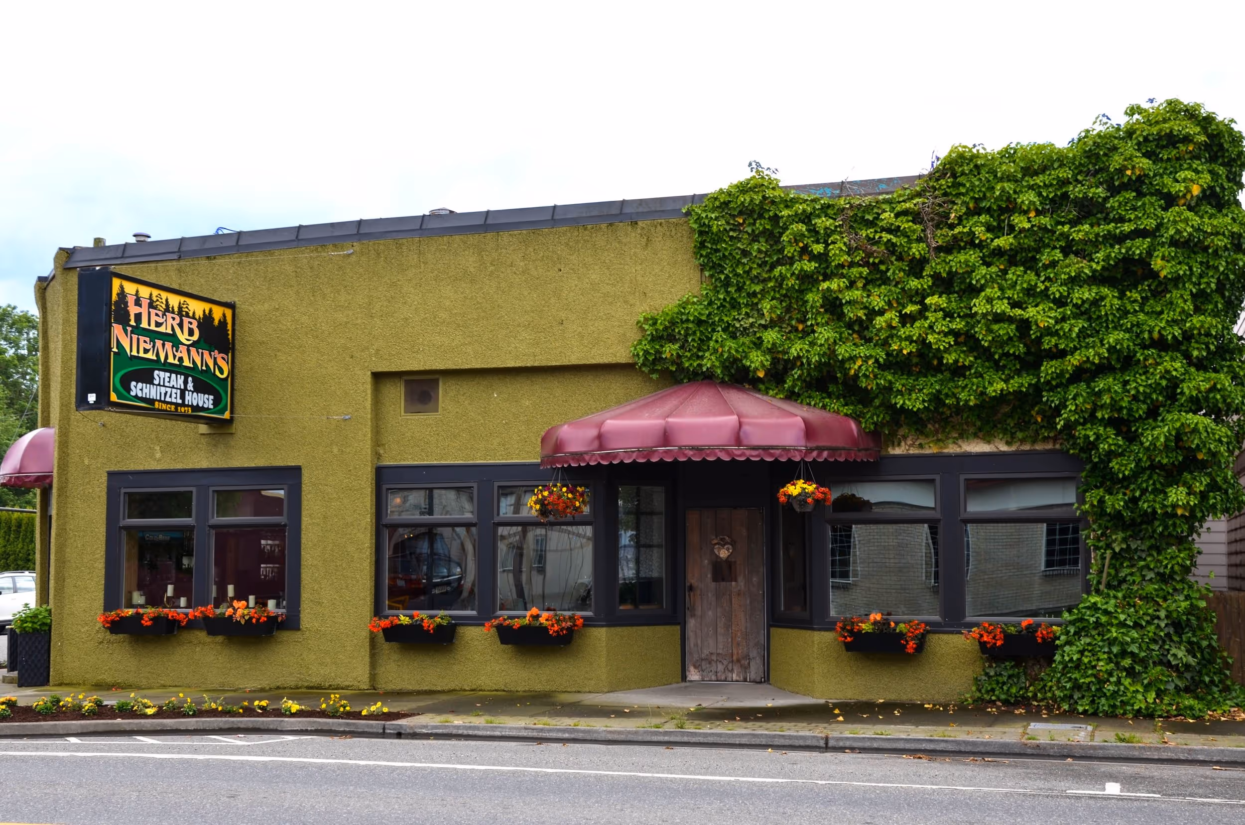 A building featuring a prominent green awning at its entrance.