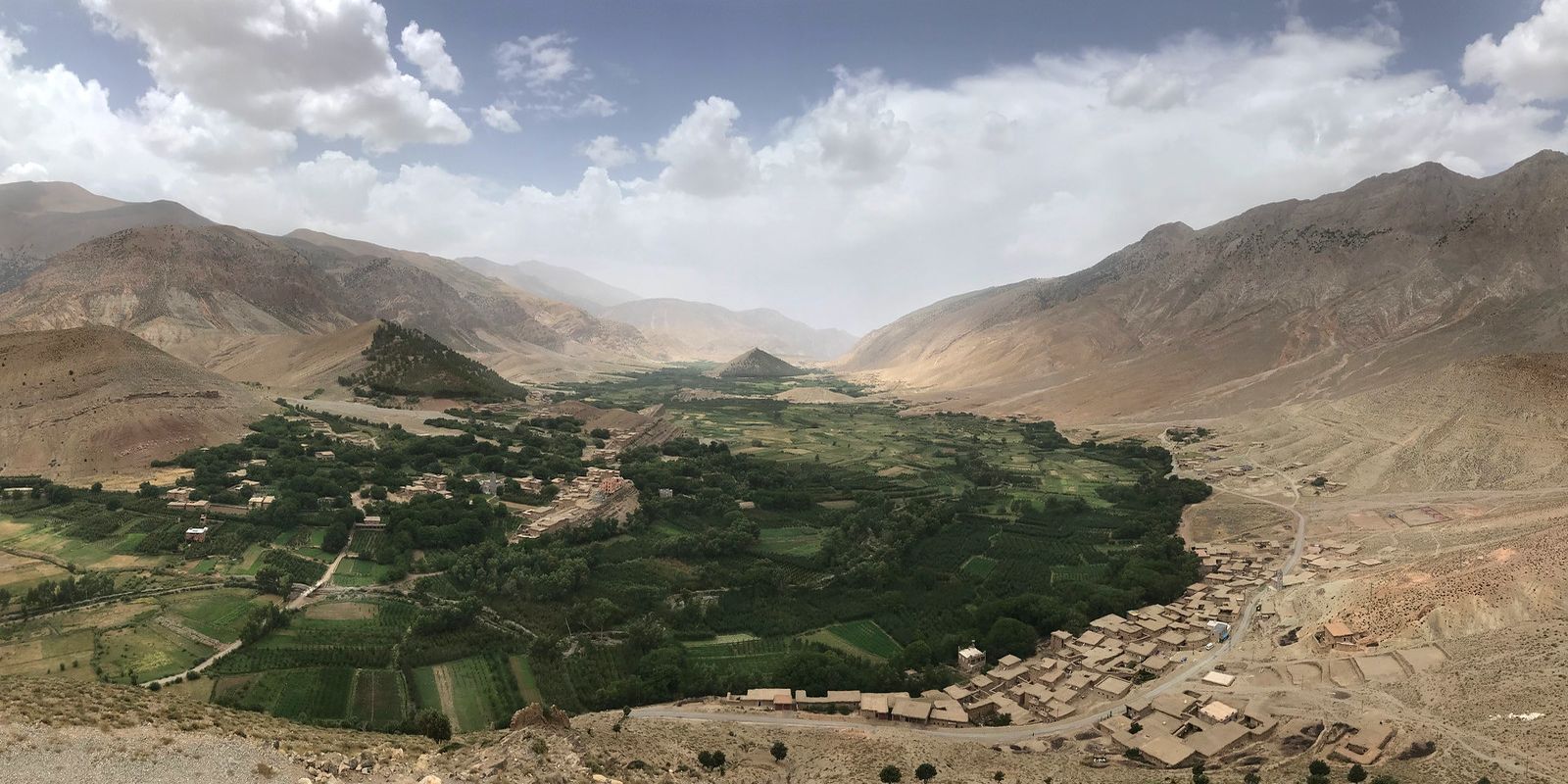Moroccan Geopark Mgoun in Ait Bougemez happy valley with green oasis and berber village landscape in the high atlas mountains