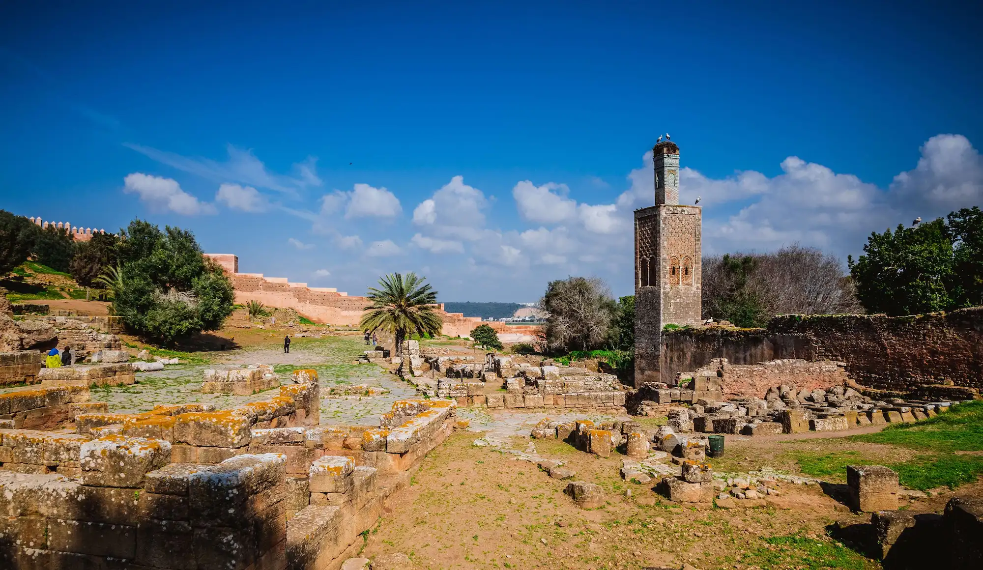 Ancient ruins of Chellah with minaret in Rabat, Morocco under blue sky during a tour with Moroccan Guides Travel