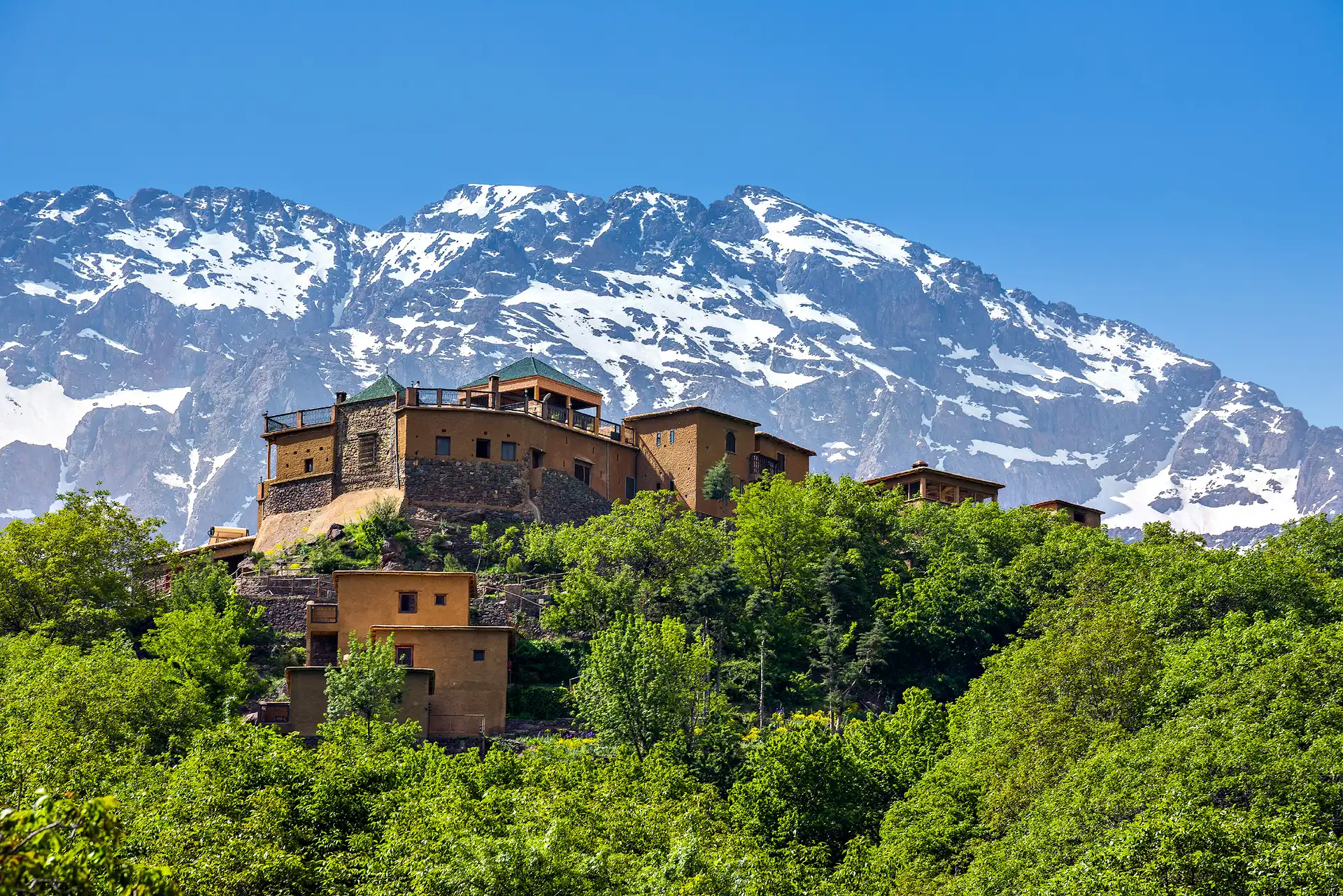 Guided Tour of the three valleys of Morocco's Atlas Mountains with Traditional Stone Buildings