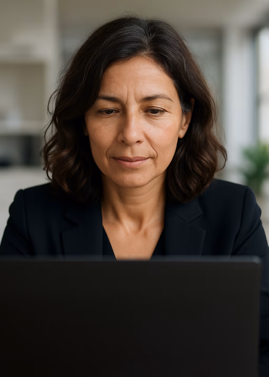 Headshot of woman in business attire.