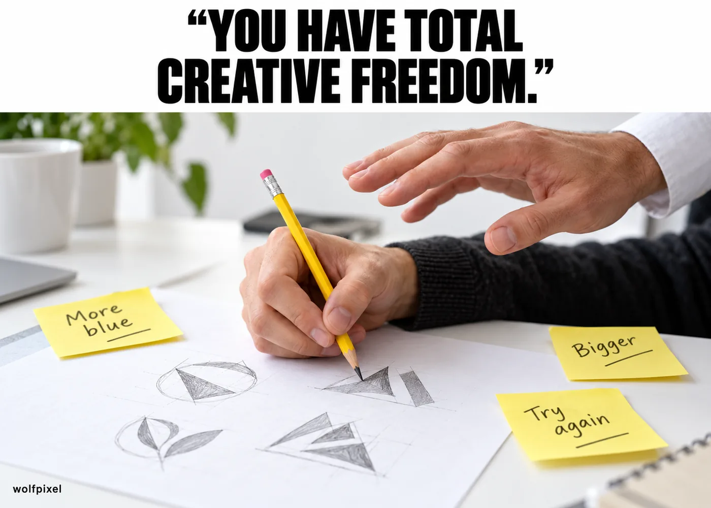 Total creative freedom client meme with a client's hand hovering over a designer's pencil sketches