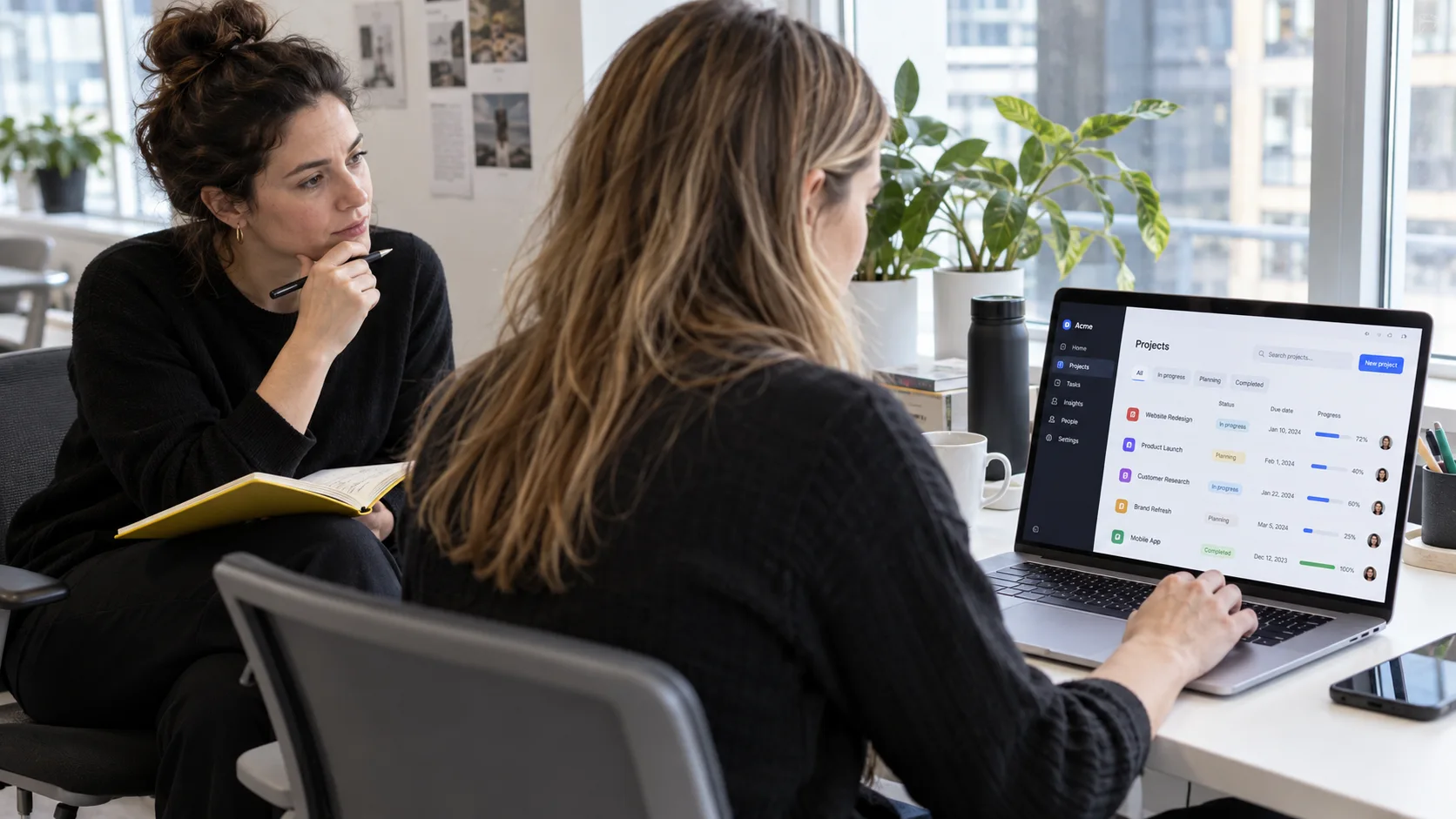 Researcher observing a business user working through a SaaS workflow