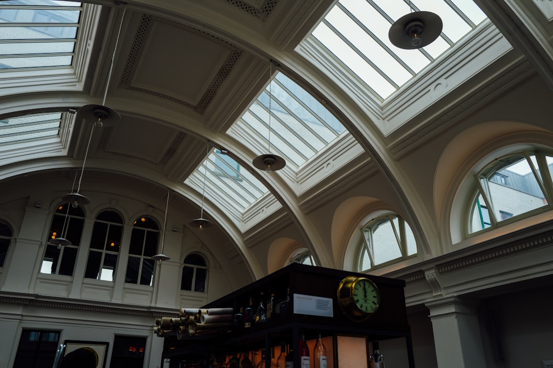 Interior view of a building with arched windows and skylights