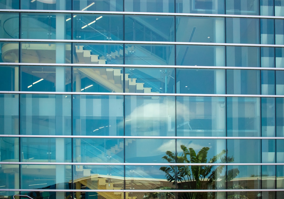 Glass building reflecting the surroundings.