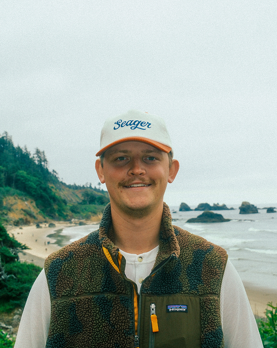 Image of Max Petersen on a coastal beach