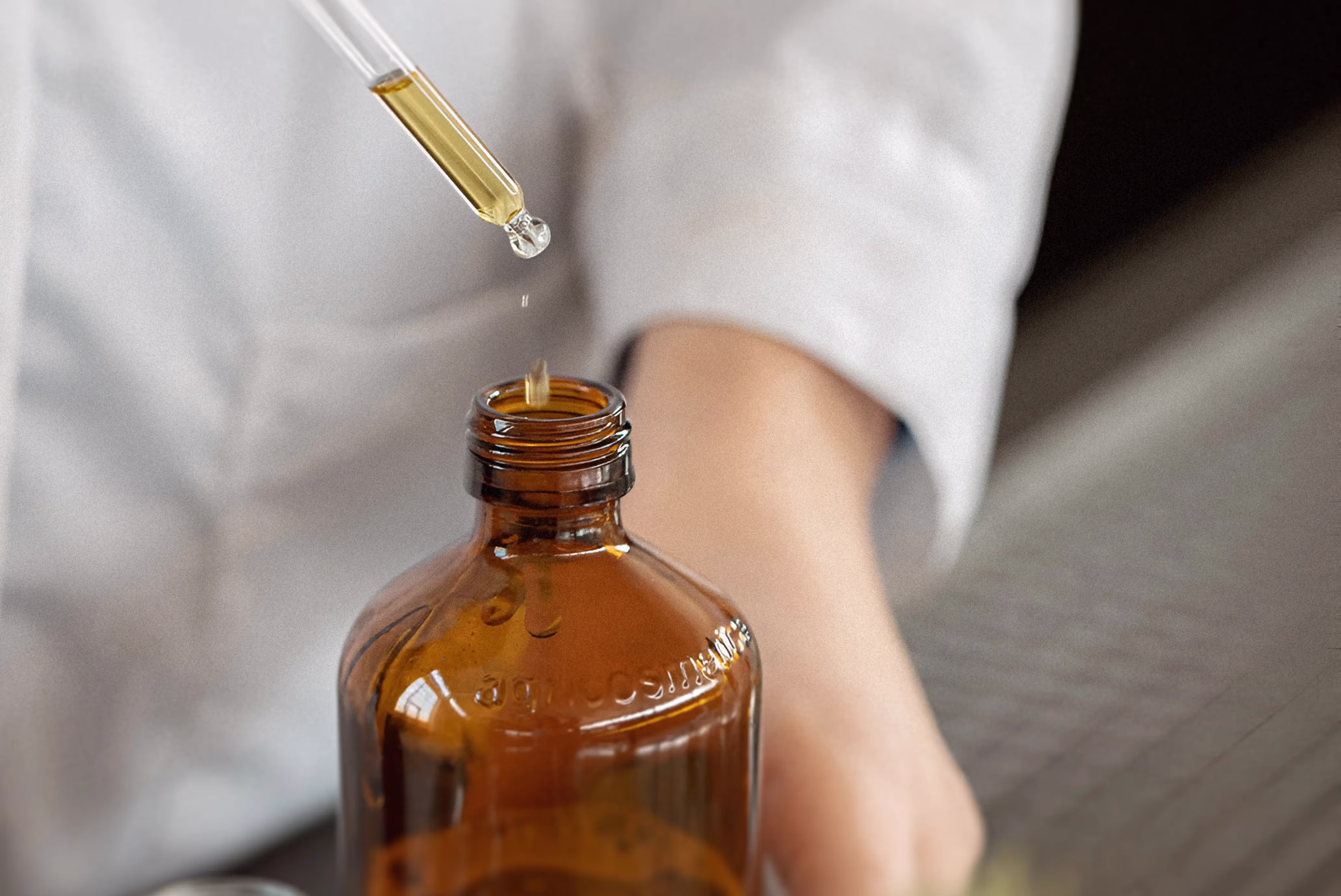 Dripping liquid into a bottle