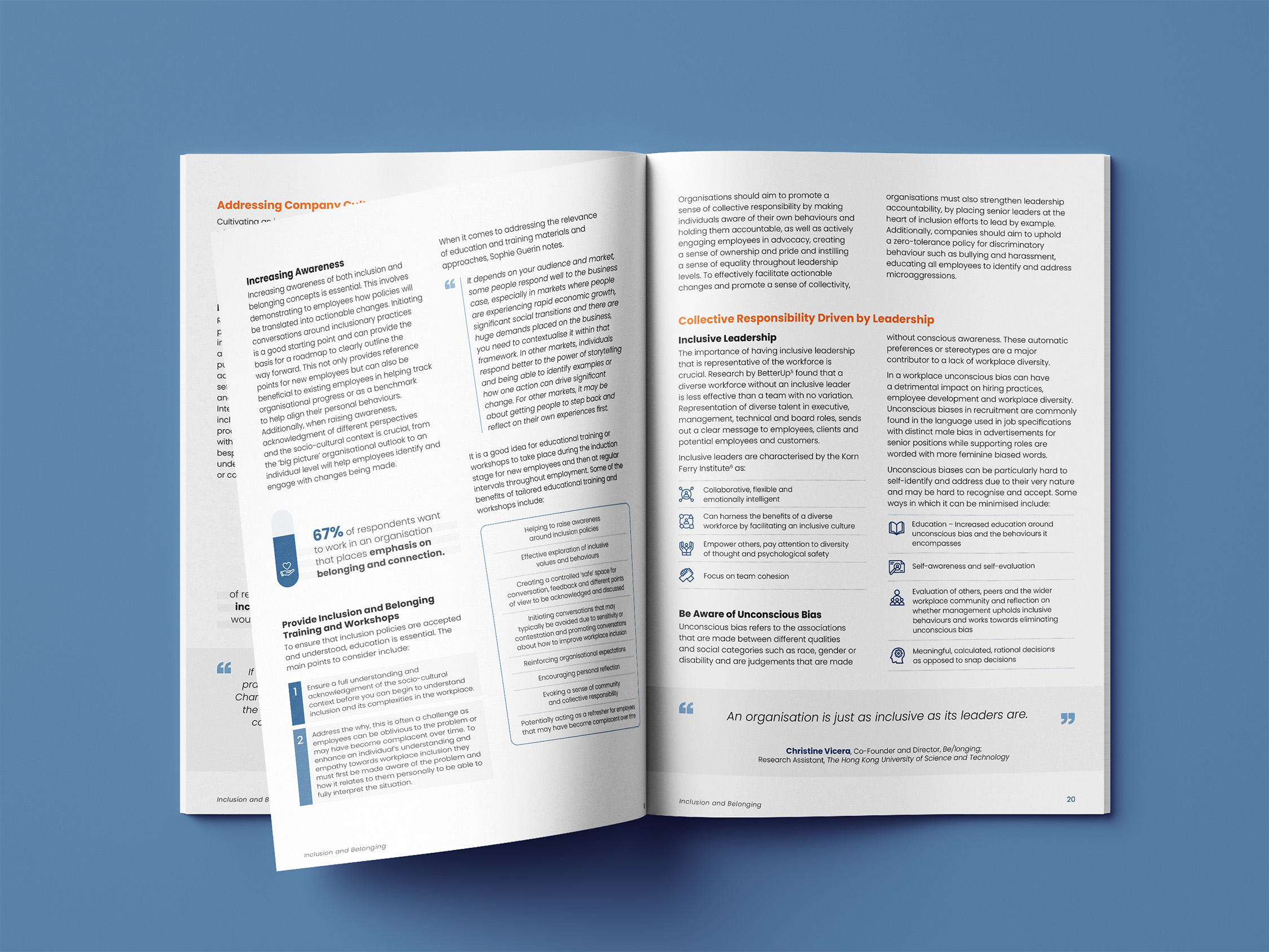 Open booklet on a blue surface showing text and diagrams about inclusive leadership, unconscious bias, and inclusion training workshops.