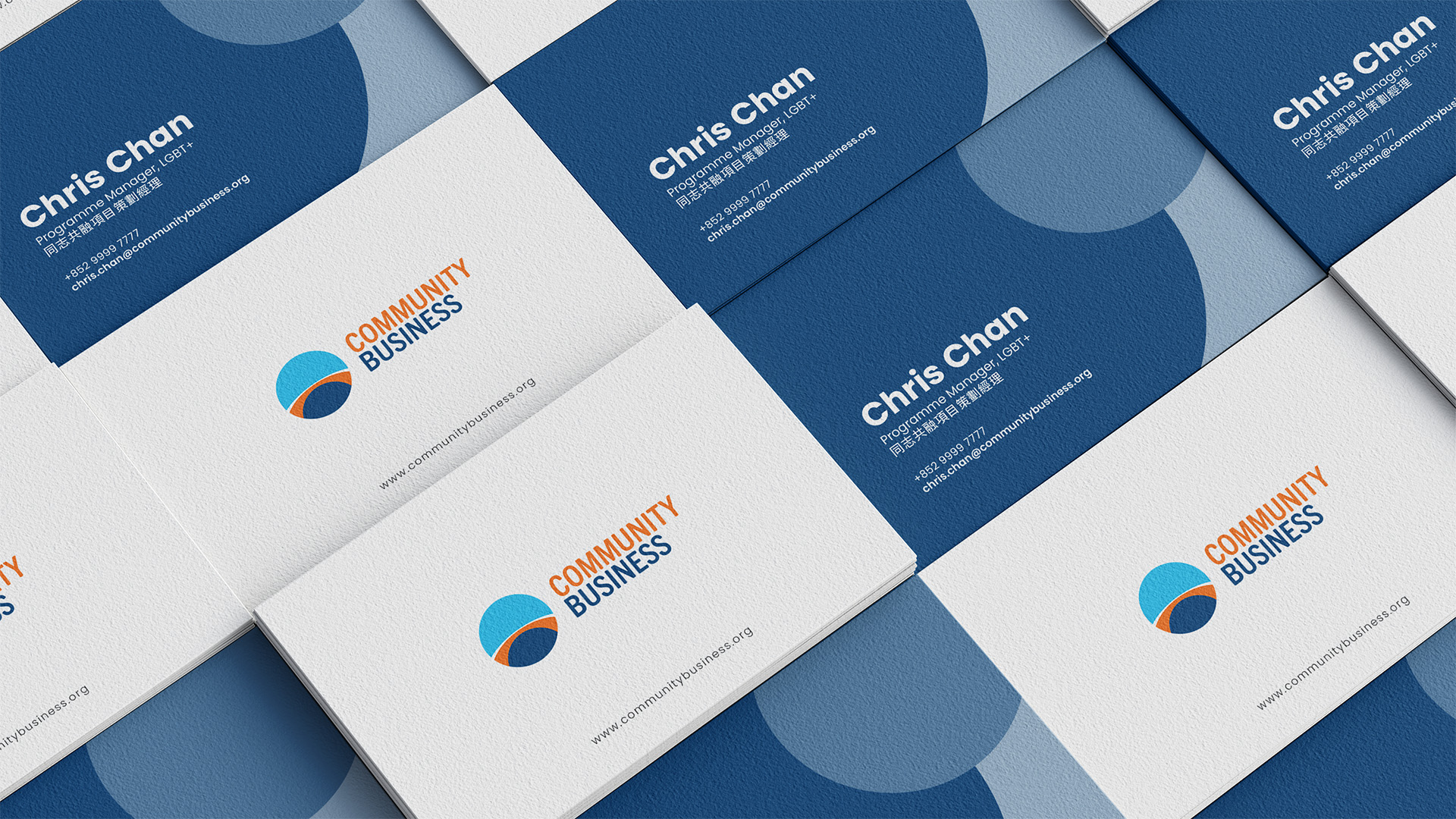Community Business business card front and back showing new logo and navy colour system