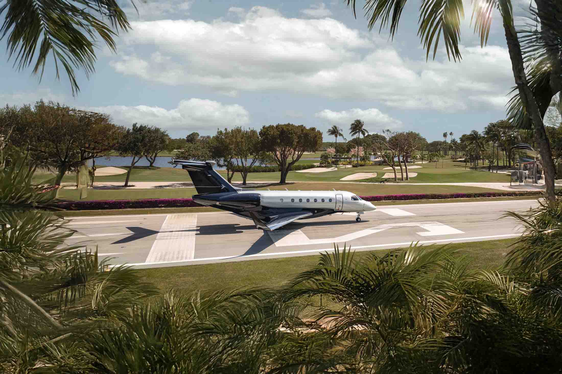 A Praetor 600 by Embraer prepares to takeoff from a private airstrip