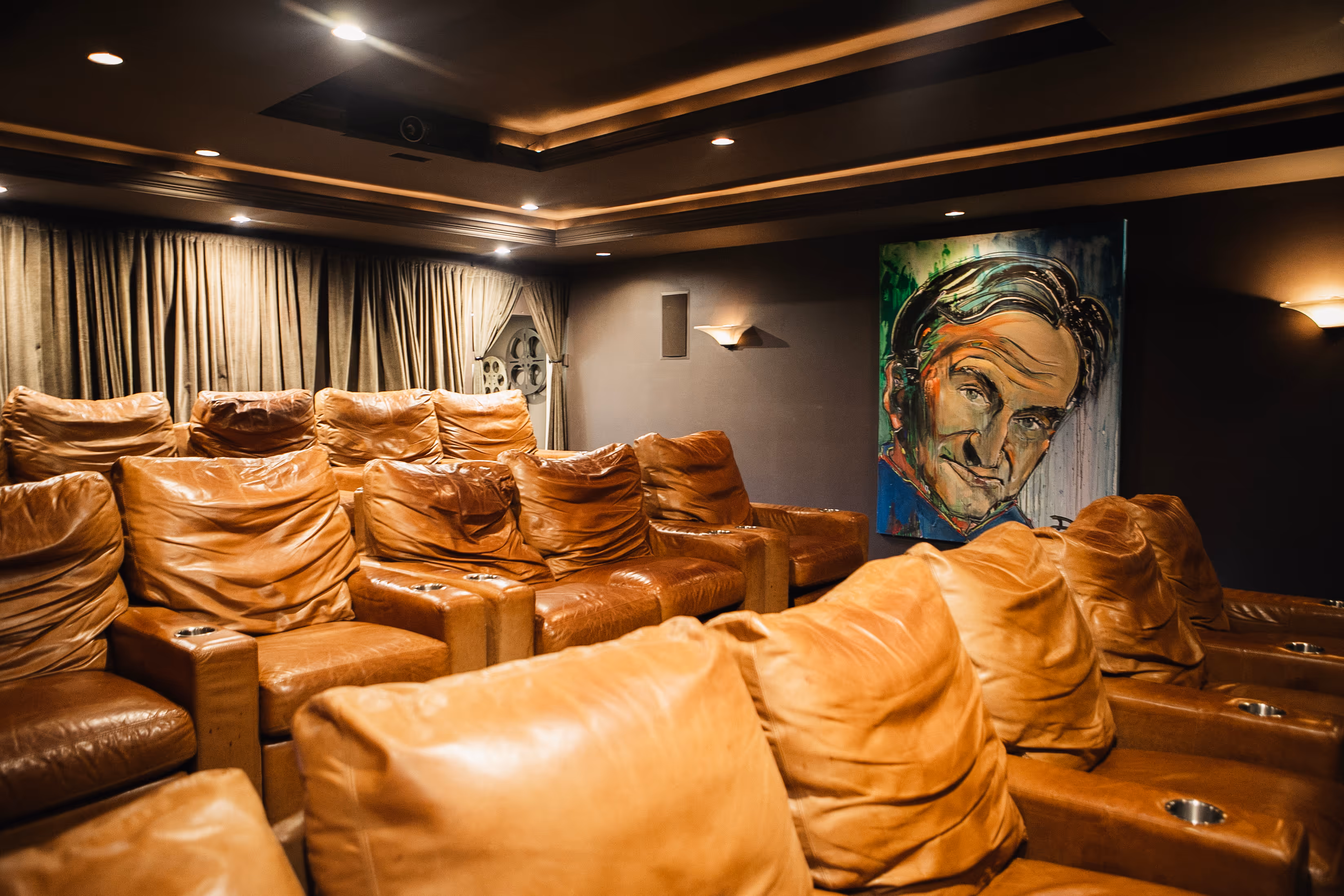 Ark's large 16 person in-home movie theater amenity 