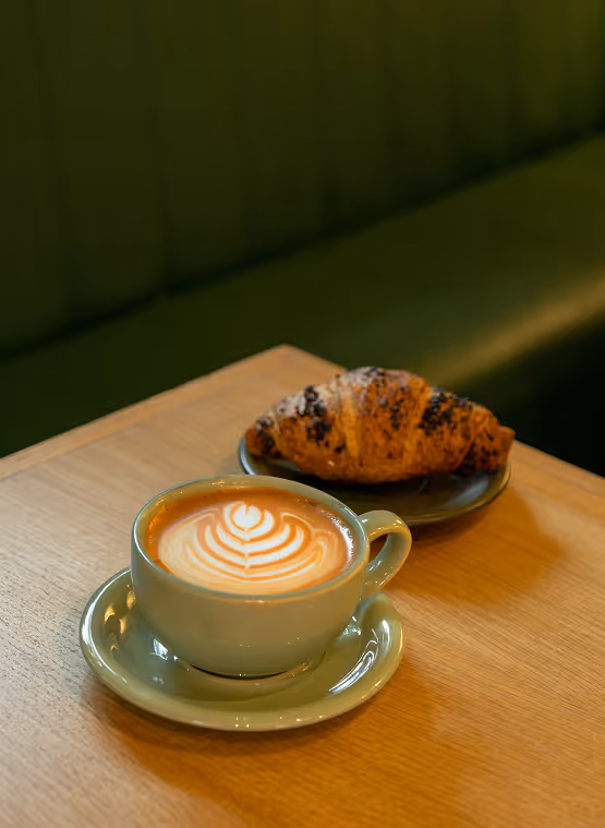 Latte art and croissant at a café in Windsor Terrace, Brooklyn Near The Windsor condominiums