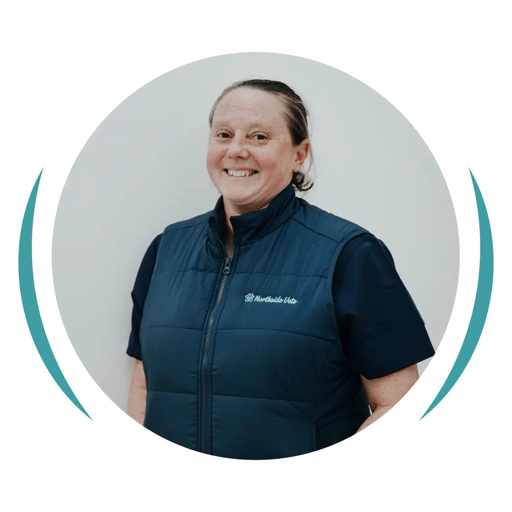 Nadine from Northside Vets smiling in a navy clinic vest.