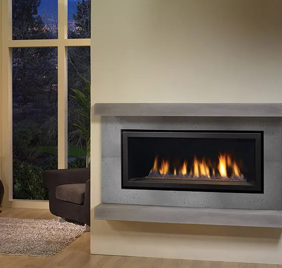 A modern Regency HZ40E linear gas fireplace featuring clean, vibrant flames and a sleek grey concrete-style surround with a floating mantel, perfectly suited for a contemporary living room in London, Ontario.