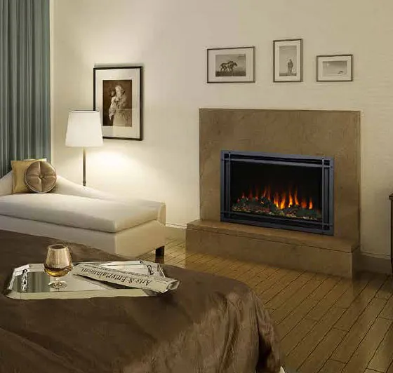 A modern black electric fireplace insert installed in a master bedroom with a tan stone surround.