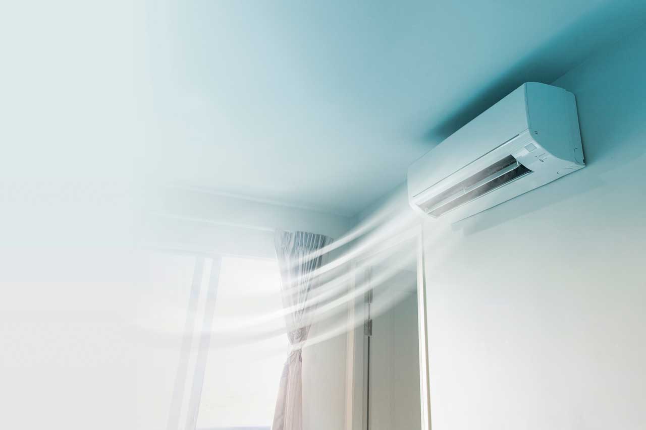 A ceiling ac unit blowing our cool air.