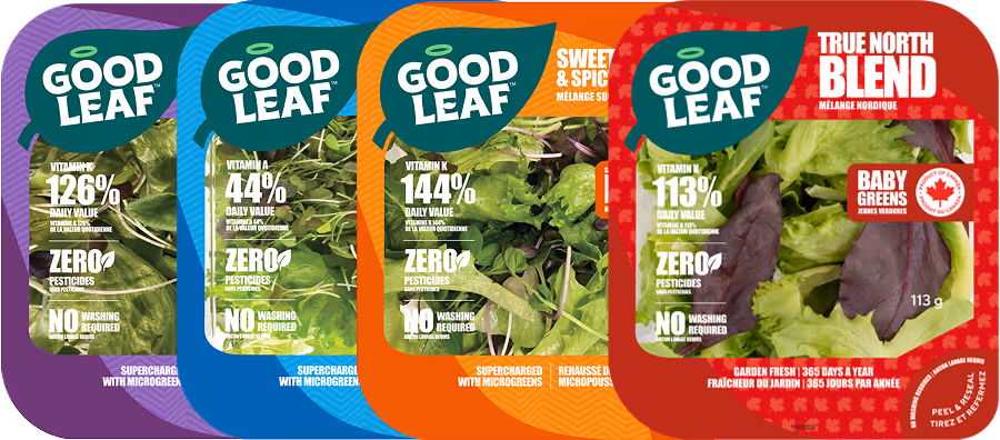 Packaging of four GoodLeaf baby greens mixes with nutritional info highlighting vitamins, zero pesticides, and no washing required.