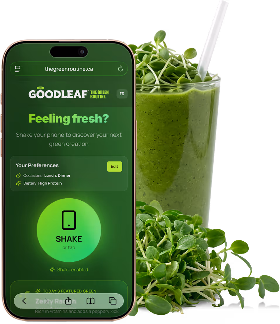 Smartphone screen showing Goodleaf green smoothie app interface with shake feature, next to a glass of green smoothie garnished with fresh sprouts.