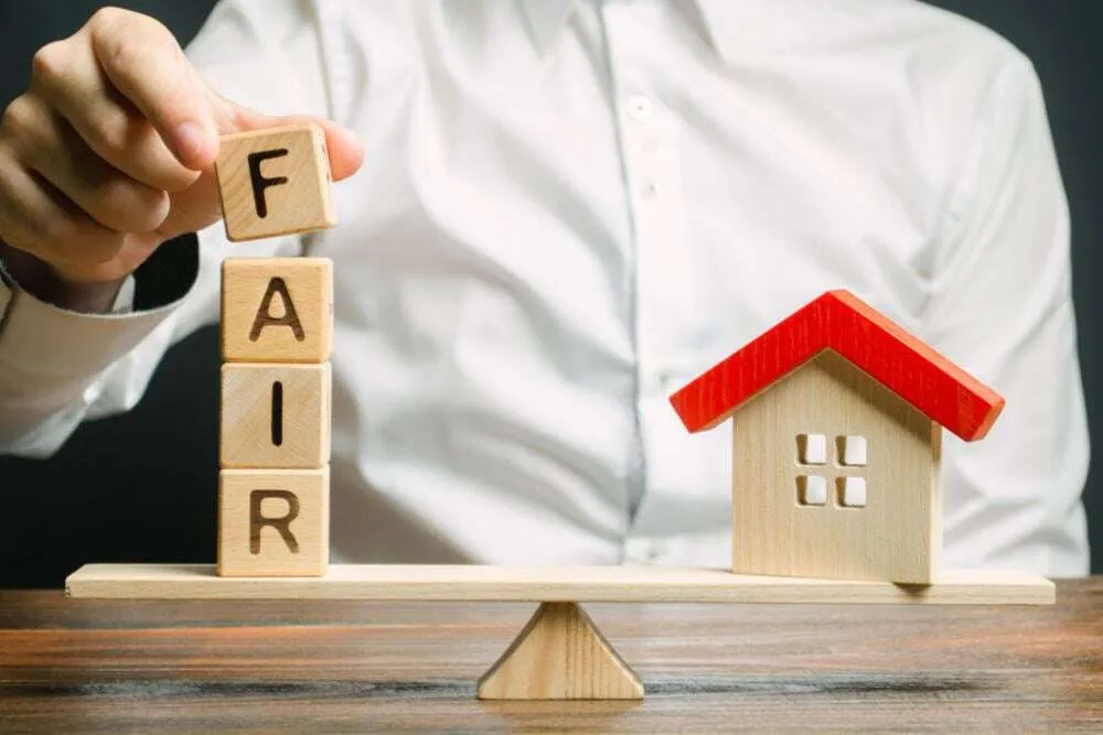 Property manager reviewing fair housing compliance policies