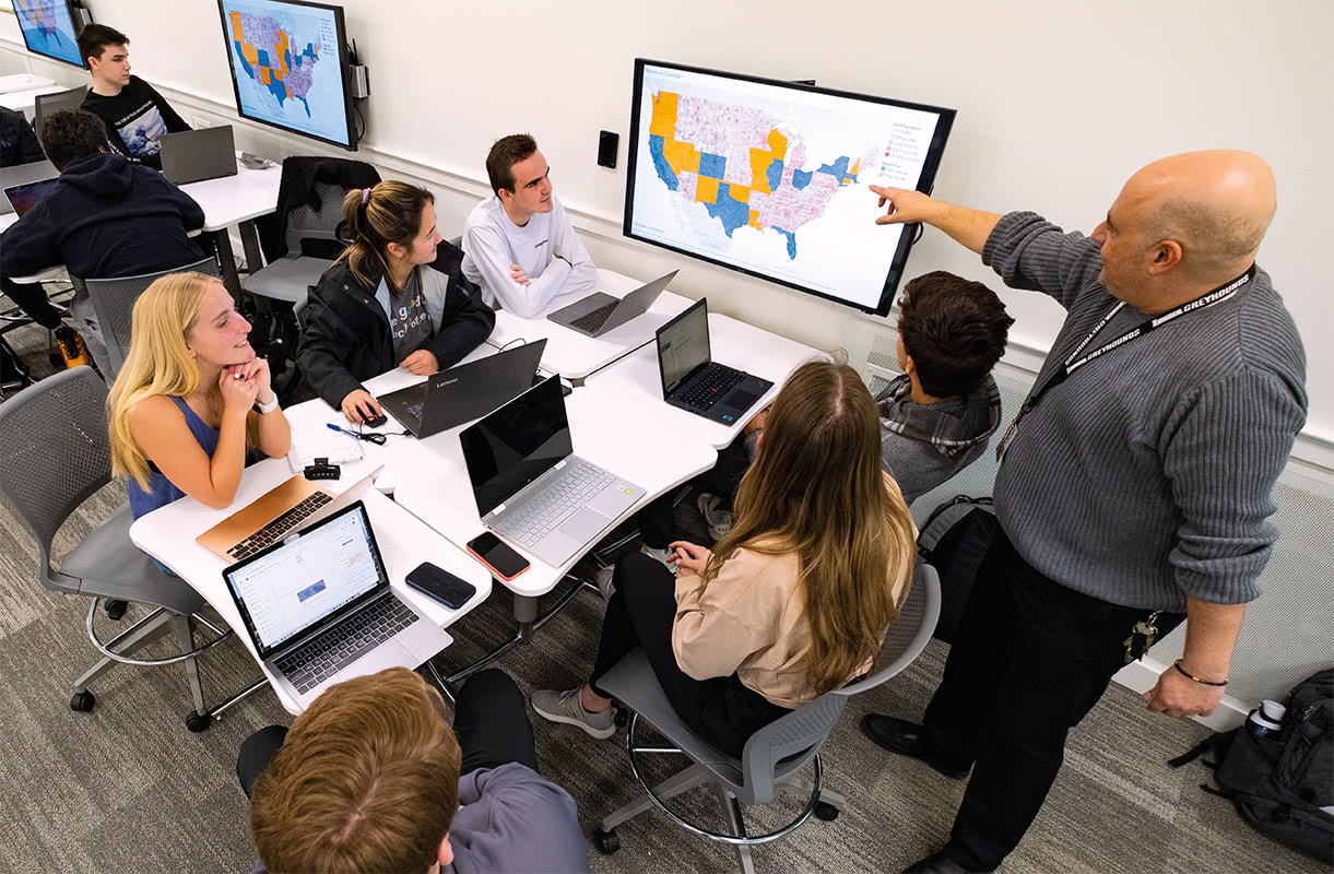 Affordable housing staff managing resident recertifications with automated property management software